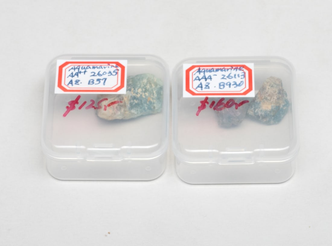 Three High Quality Aquamarine Stone Nuggets: Three high quality aquamarine stone nuggets, with two cases. Approx. 15.6 gram (total weight), 1*0.73*0.6 inch (largest).