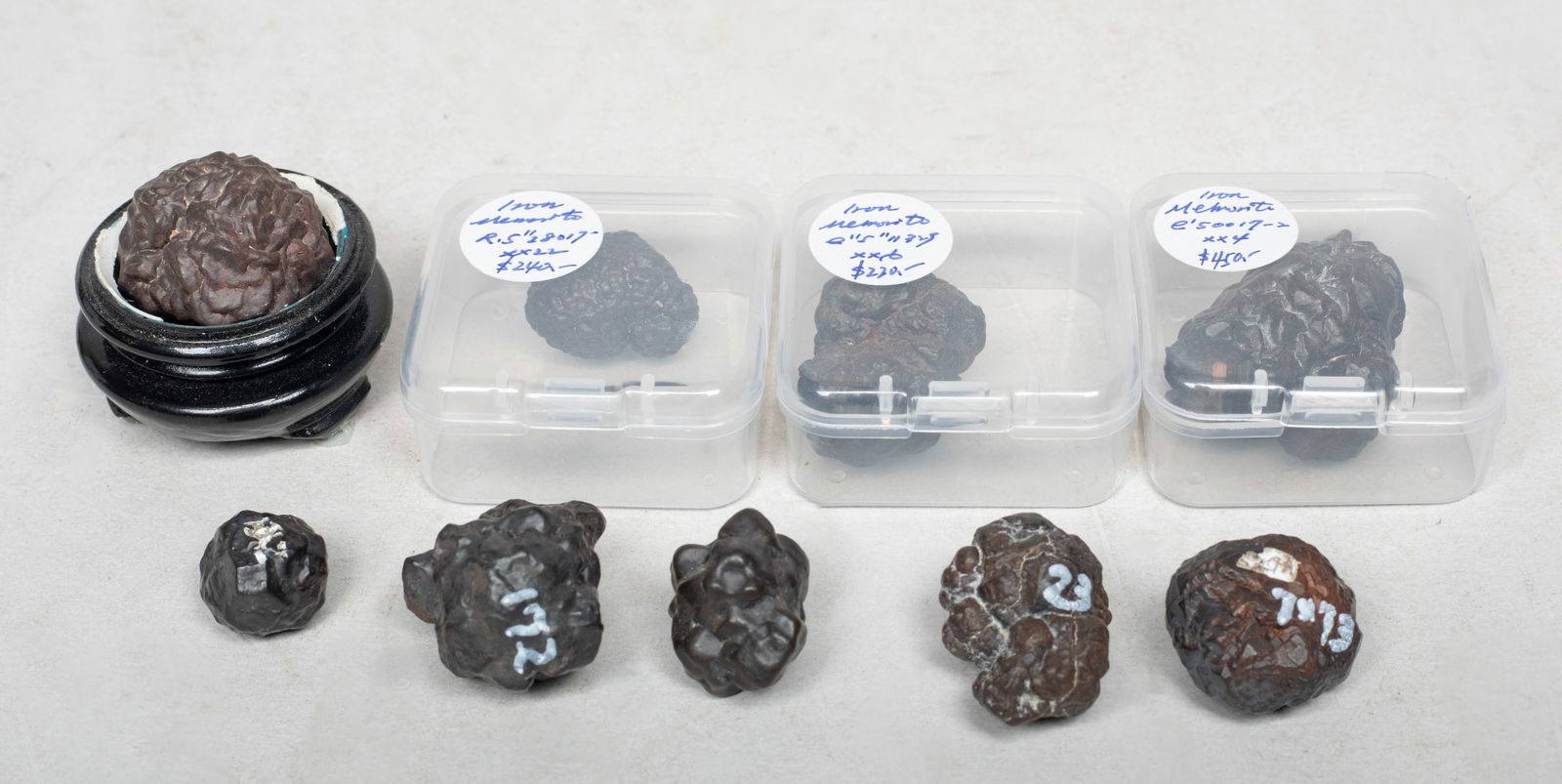 Estate Set Meteorite Stone Nuggets: Large set of meteorite stone nuggets, with a stand and three cases. Size varies.