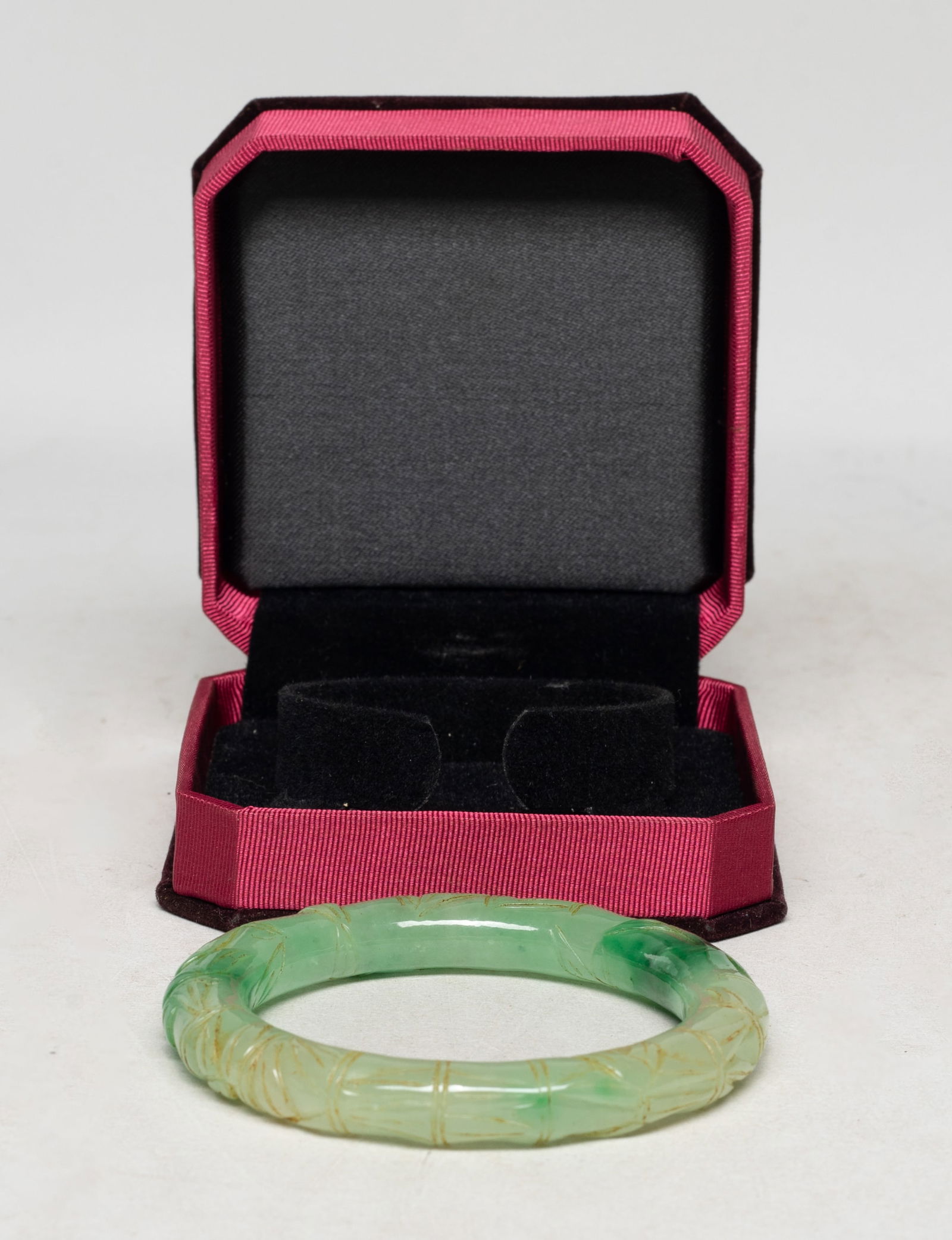 Estate Chinese Bamboo Form Bangle: Chinese colored stone carved bamboo form bangle, with box. Approx. 3.28 inch outer diameter, 2.35 inch inner diameter.