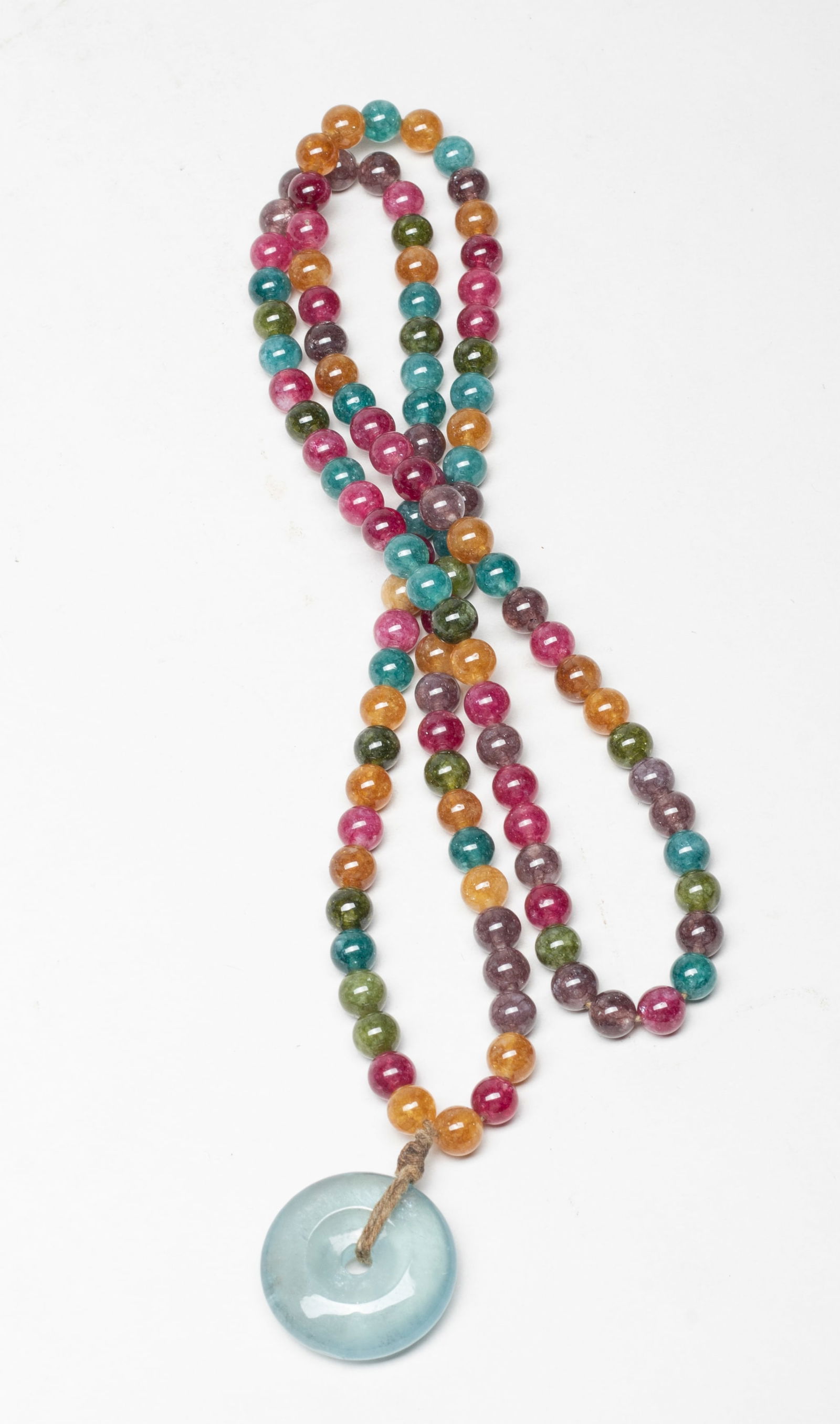 High Quality Aquamarine Pendant w/ Necklace: Collectible gemstone bead necklace with a high quality aquamarine carved disc form pendant. Approx. 33 inch L. The Estate of the Consignment Store Closed Sale, Palm Springs, CA, 2022.