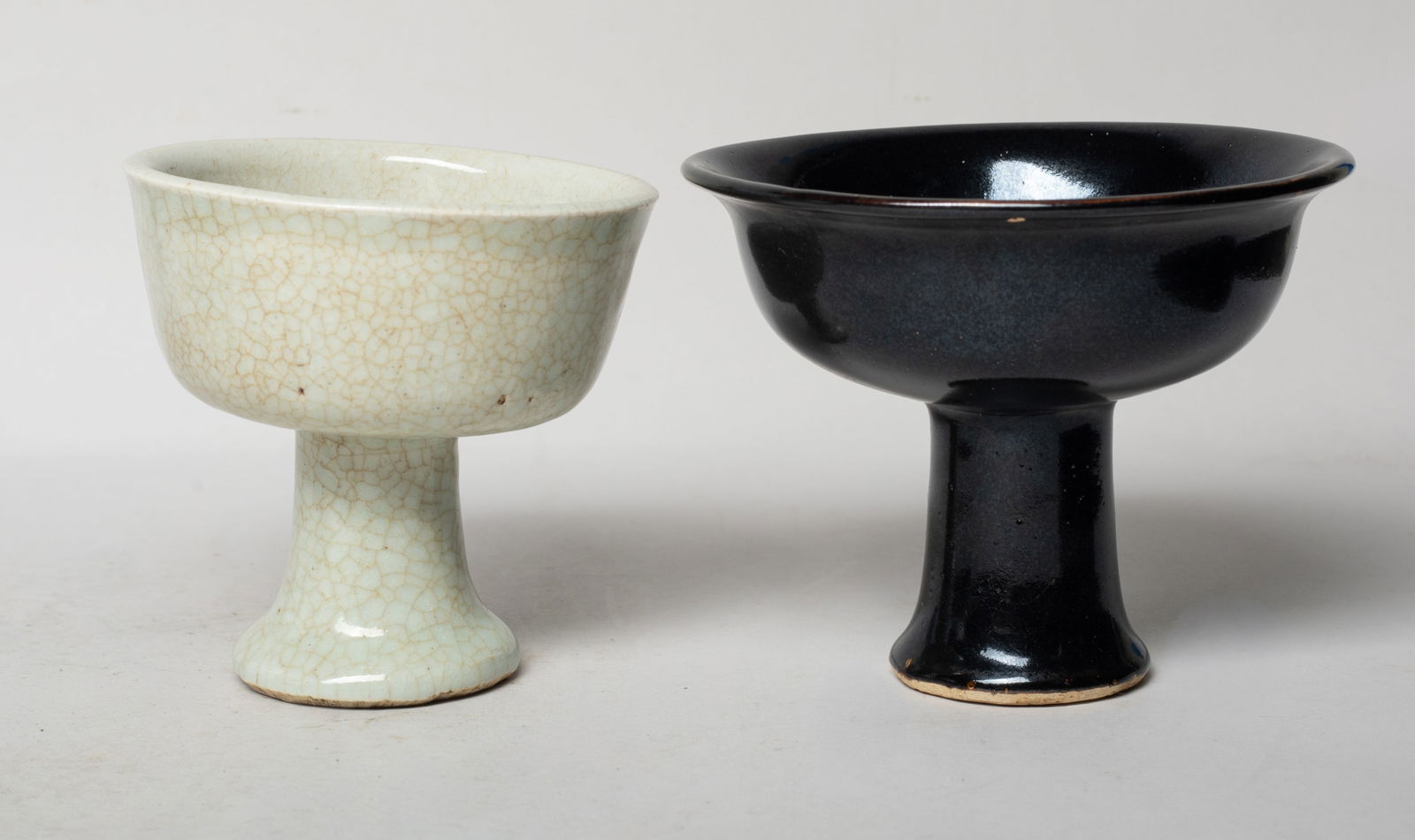 Two Chinese Export Porcelain Tall Cups: One cup overall covered with crackled grayish white glaze, the other cup covered with rich black glaze, the interior decorated with a russet leaf. Approx. 5*4 inch (larger).