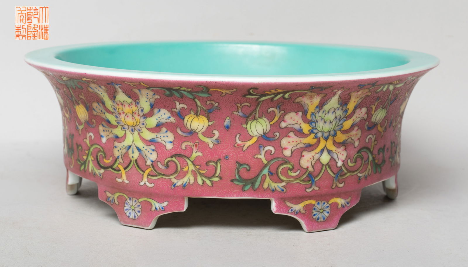 Estate Chinese Export Large Porcelain Deep Bowl: The bowl exterior enameled with lotus scrolls on rouge pink glazed background, the interior applied with light turquoise glaze, the bottom with a six-character mark in copper red. Approx. 10.3*3.5 inc
