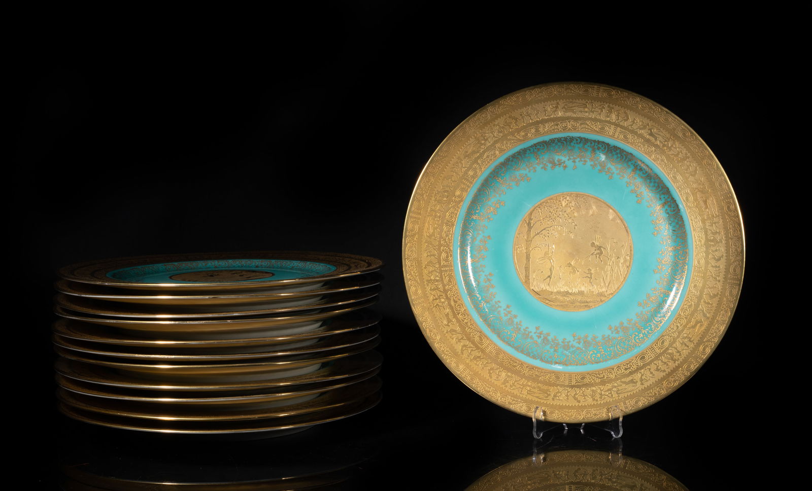 Set Vintage Gold Plate Porcelain Plates: Set of vintage porcelain plates, the interior gilded with little elves playing in the fields, against turquoise glazed background, the rim gilded with bands of foliage and figural scene, the bottom ma