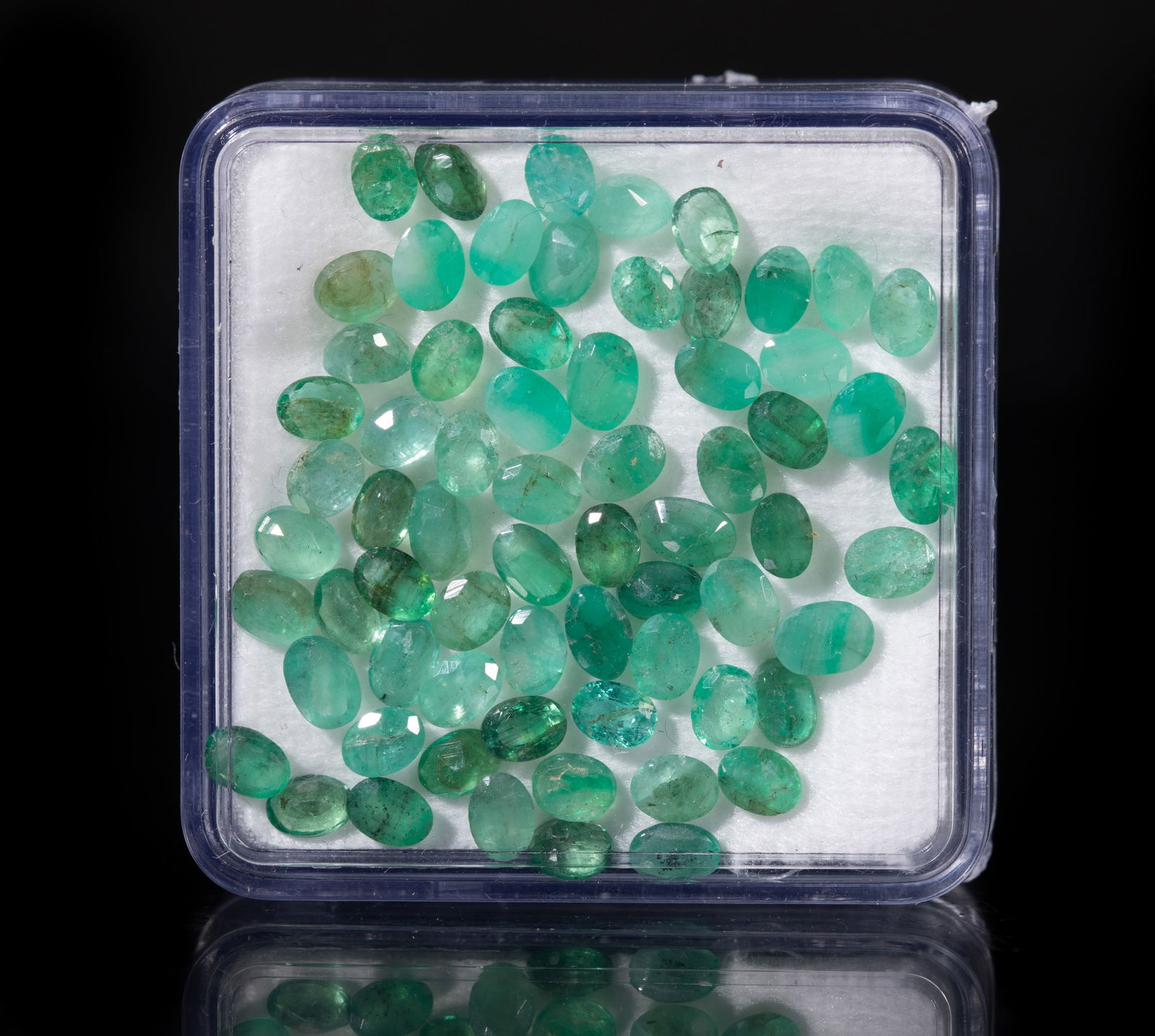 Estate Set Cut Emerald Stones: Set of emerald cut stone pieces, with case. Size varies.