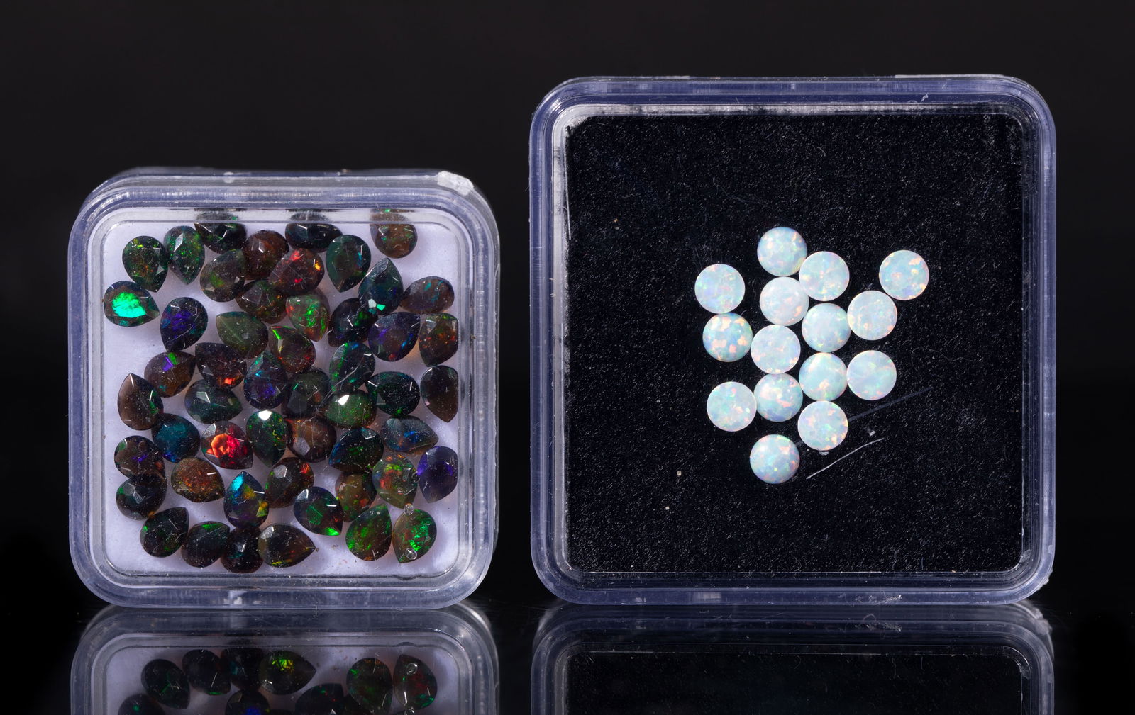 Collectible Set Cut Fire Opal Stones: Set of fire opal cut stone pieces, with cases. Size varies.