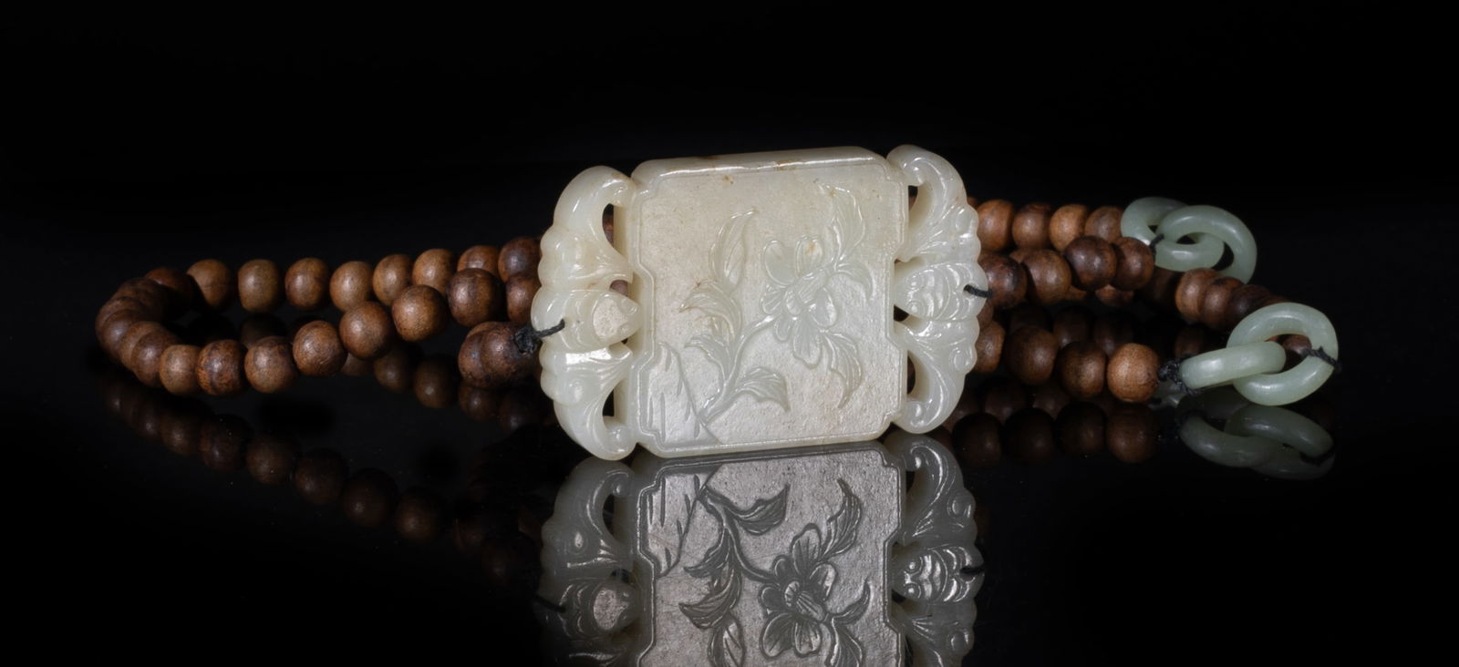 Vintage Chinese Export Agarwood, Jade Necklace: Long Chinese agarwood bead necklace, slightly fragrant, with interlocking jade loops, suspended with a jade plaque carved on one side with flower and the reverse with a seal mark, flanked by a pair