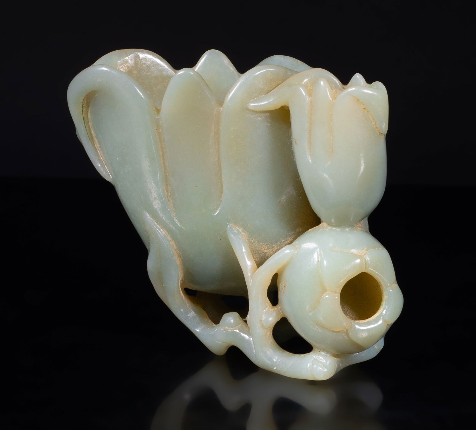 Rare Chinese Russet Jade Sculpture of Vase: Crisply carved and hollowed as a flower, issuing from long curling stems forming the base and issuing a further smaller flower and a hollowed pomegranate, the stone of pale celadon tone. Approx.