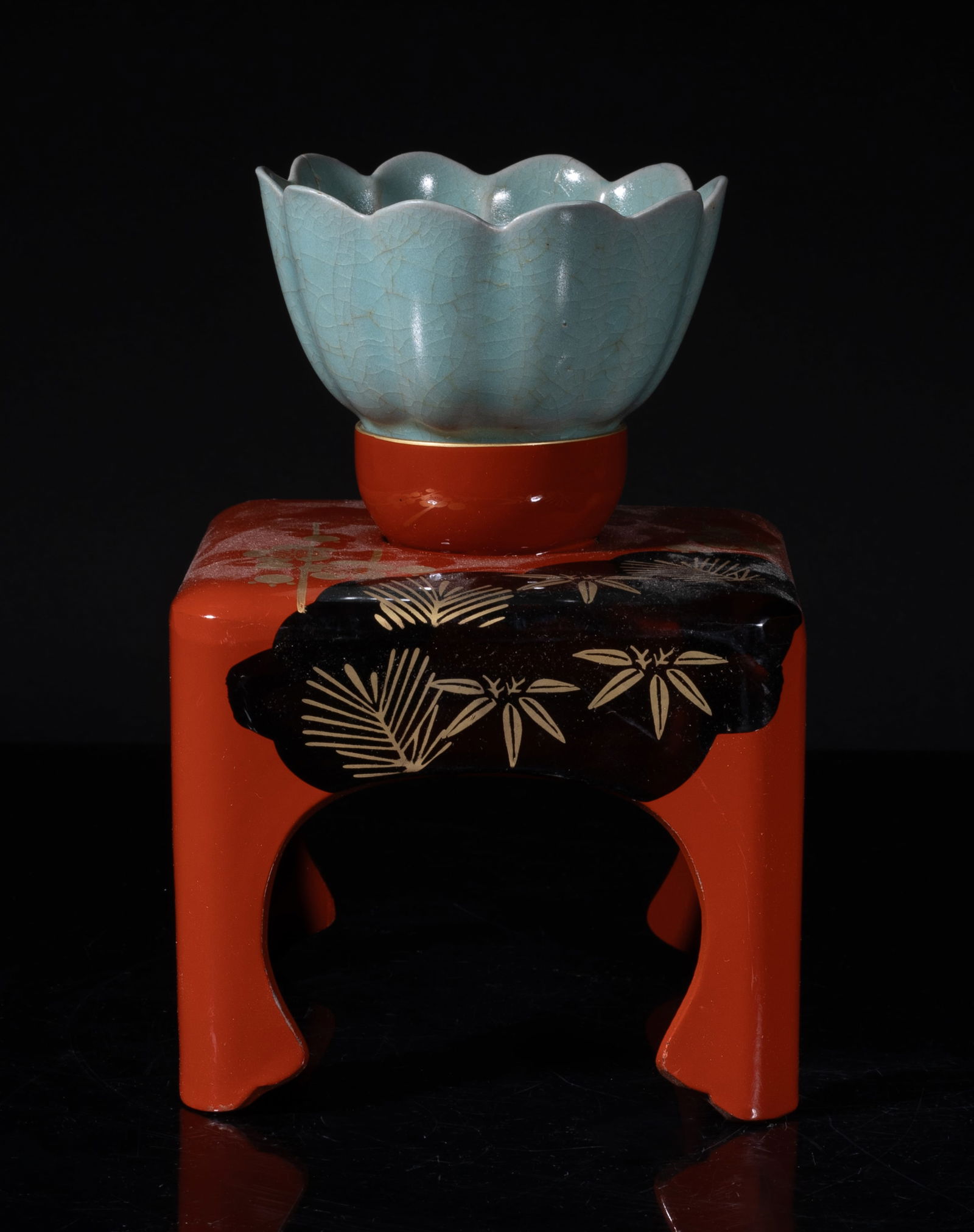 Estate Chinese Export Porcelain Tea Cup: The tea cup molded of floral form, overall covered with crackled bluish celadon glaze, repaired, with a tall stand decorated with plum blossoms, bamboo leaves, and pine needles. Approx. 3.5*2.1 inch (