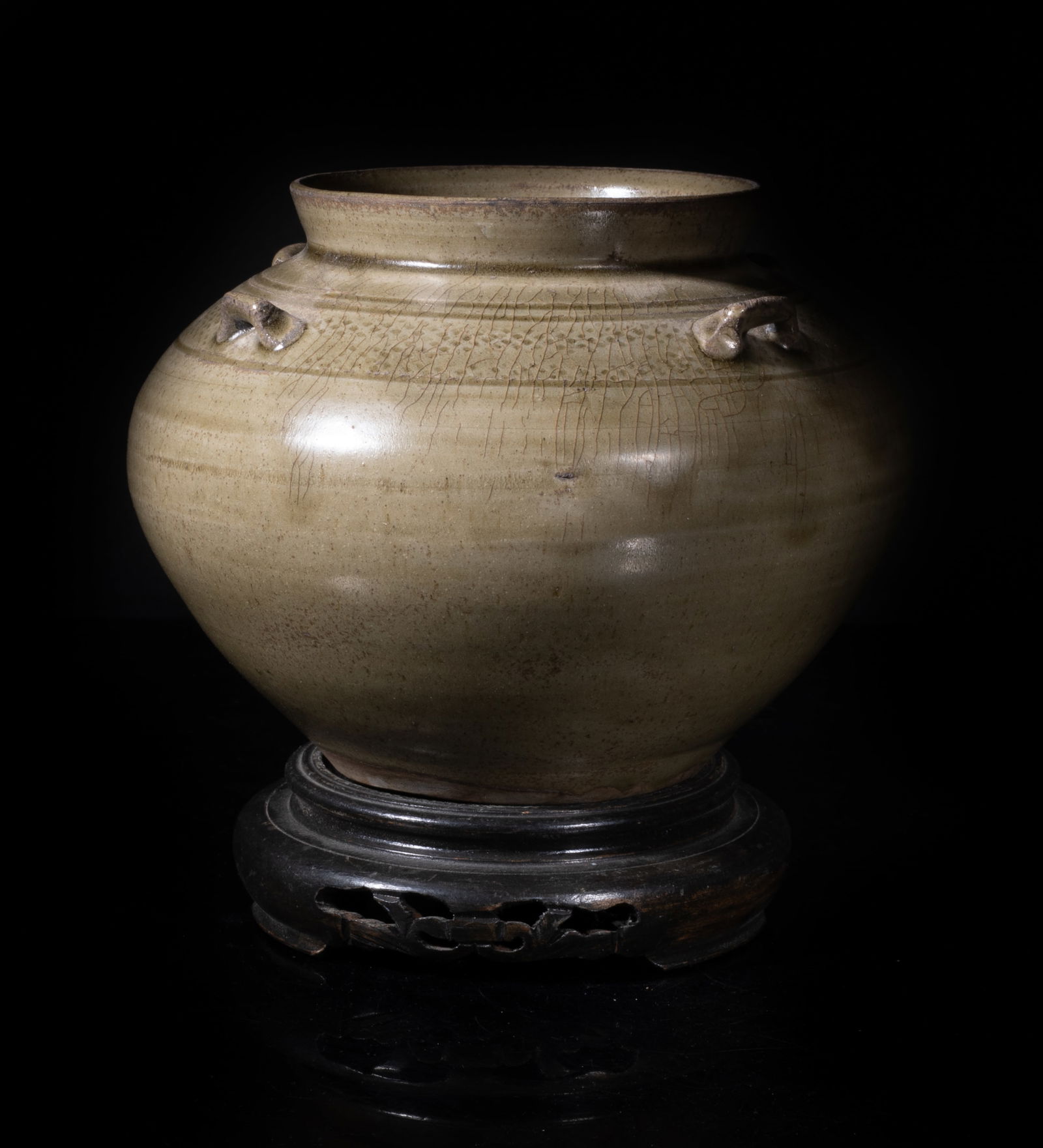 Chinese Shipwreck Yue Ware Porcelain Jar: Of tapered ovoid form with a short flared mouthrim, set with four raised handles, covered overall save for the foot with mottled olive-green glaze, with stand. Approx. 6*4.6 inch (w/o stand).