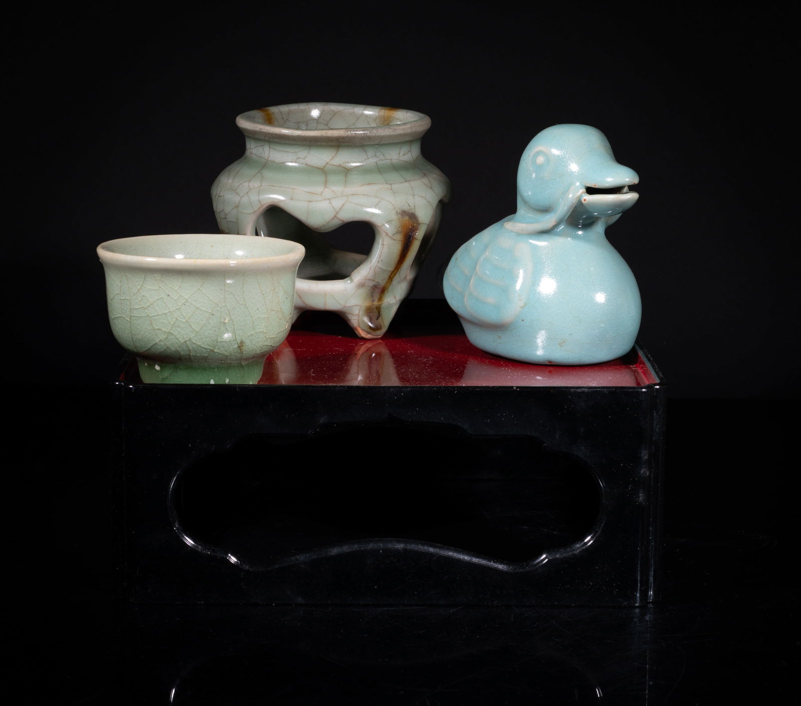 Estate Chinese Export Porcelain Tea Sets: Including a tea cup covered with crackled celadon glaze, a censer covered in celadon glaze suffused with brown crackles, and a bird sculpture covered with crackled blue glaze, with a stand base.