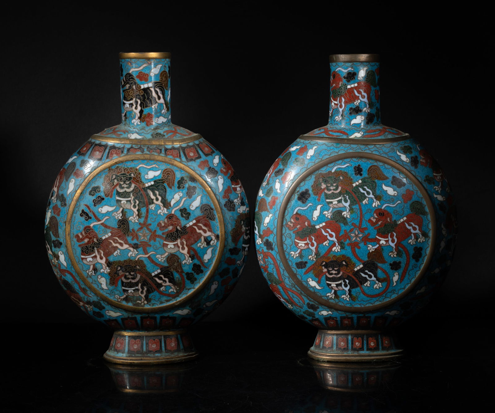 Pair Chinese Cloisonne Cabinet Vases: Each of flat rounded form with a spreading foot and a cylindrical neck, enameled with mysterious beasts among clouds on turquoise blue background. Approx. 10.6*7*2.9 inch (each).