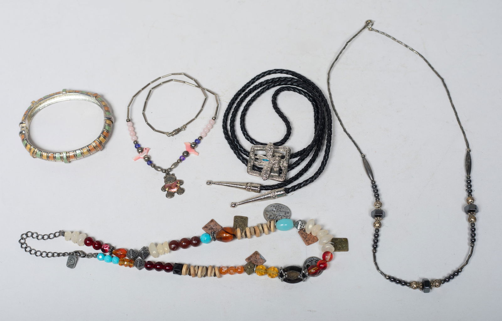 Designed American Indian Type Jewelry: Including a bangle, a polo tie, and three bead necklaces. Approx. 37 inch L (polo tie size).