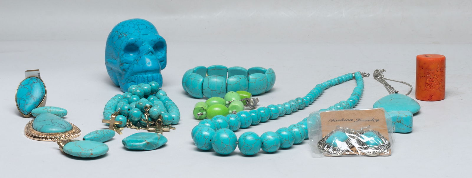 Large Set Vintage Turquoise Like Jewelry: Including turquoise-like stone earrings, pendants, beads, bracelets, necklaces, a ring, and a skull sculpture. Approx. 3*2.4*1.8 inch (skull size).