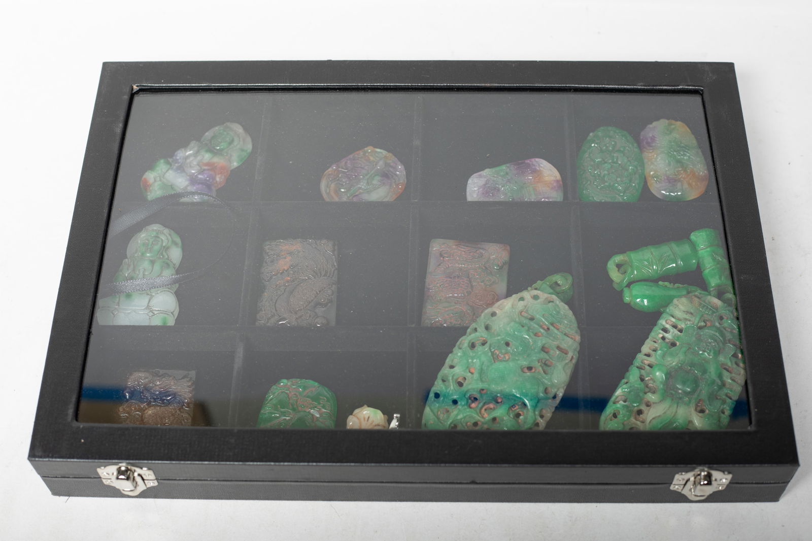 Set Chinese Export Colored Stone Carvings: Large group of Chinese colored stone carvings and a ring, carved with Buddha dragon, phoenix, beast, flower, landscape, bamboo, vase or mythological figure, with case. Approx. 4.1*2.25 inch (largest).