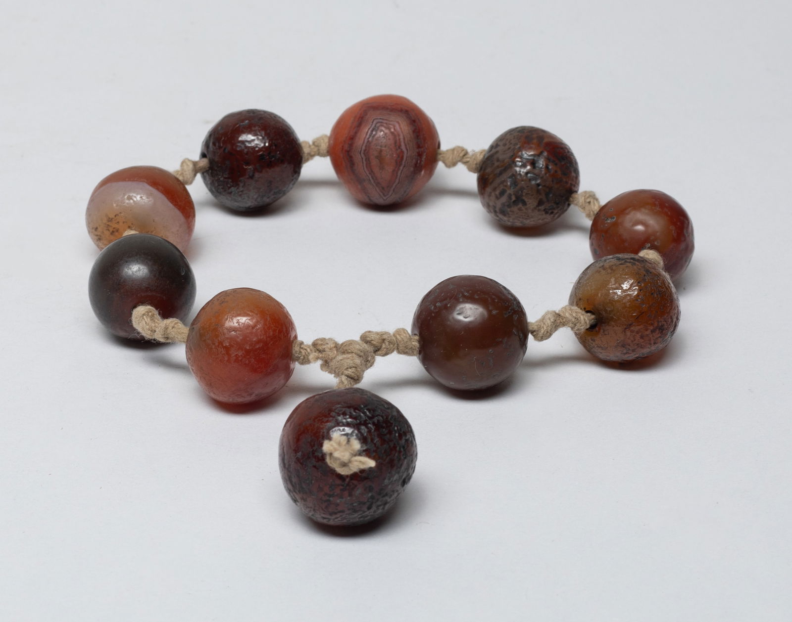 Rare Chinese Cameo Agate Prayer Beads: A string of rare large Chinese cameo agate carved prayer beads. Approx. 0.92 inch D (largest).