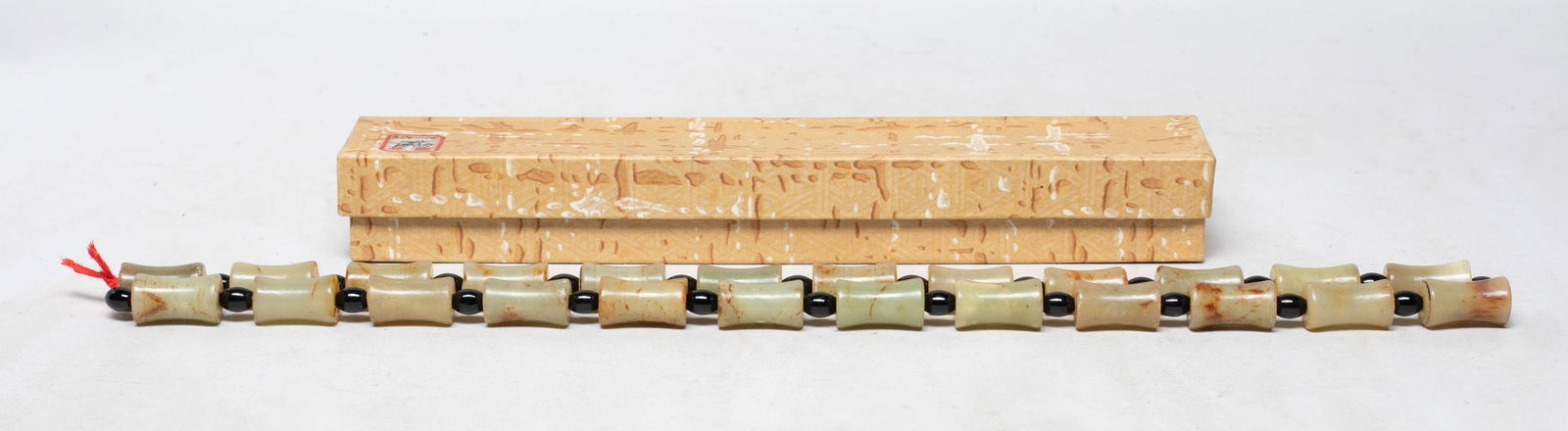 Chinese Export Russet Jade Beads Necklace: Chinese russet jade bead and black stone bead necklace, with box. Approx. 26 inch L.