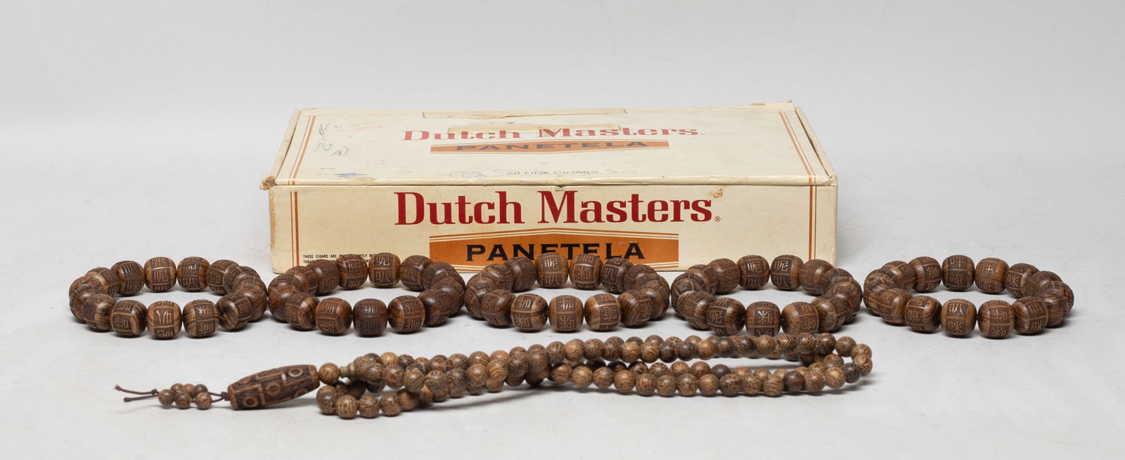 Set Chinese Export Agarwood Prayer Beads: Including five strings of Chinese agarwood prayer beads, each bead incised with "The Six-Syllable Mantra", and a long string of agarwood beads, with box. Approx. 167 gram (total wood weight), 32 inch