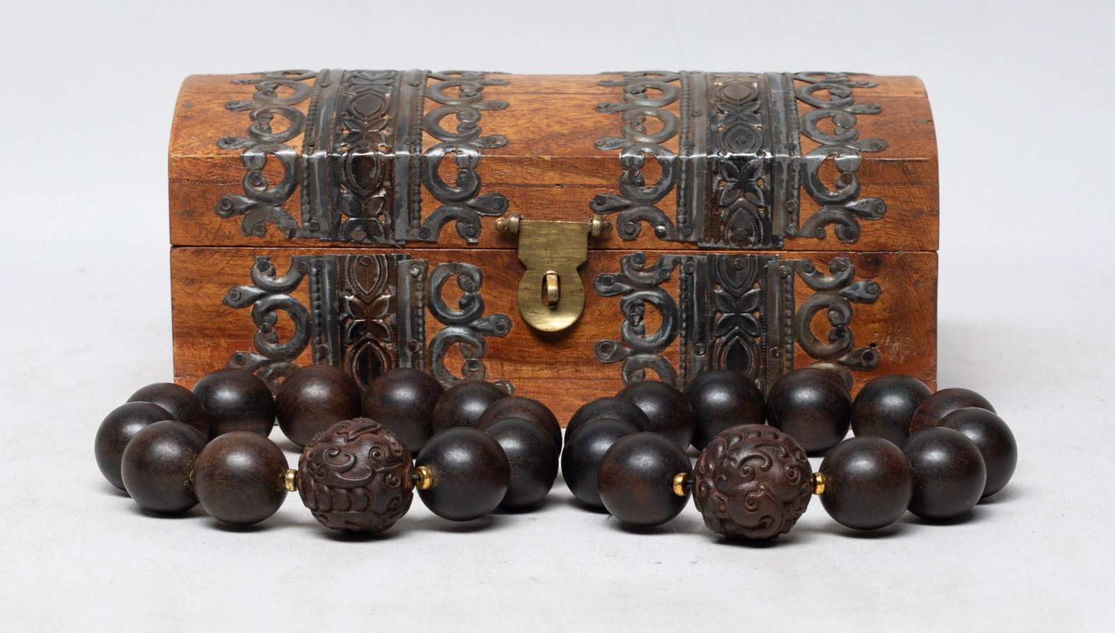 Chinese/ South Asian Agarwood Prayer Beads: Two strings of Chinese / South Asian agarwood prayer beads, the largest beads carved with stylized dragons, with a box decorated with floral motif. Approx. 120 gram (total bead weight), 0.97 inch D