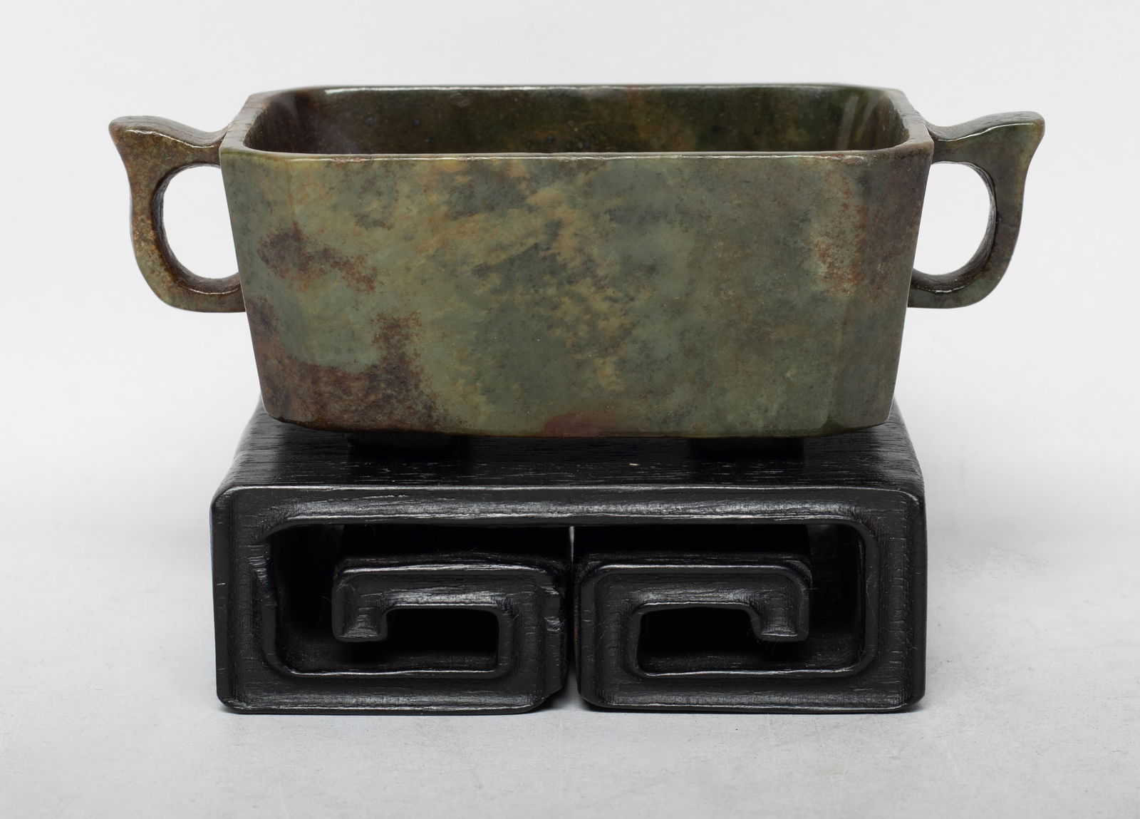 Large Chinese Russet Jade Cup w/ Wood Base: Large Chinese russet jade cup, of rectangular section, with two handles, with a wood base. Approx. 5.4*2.7*1.8 inch (w/o base).