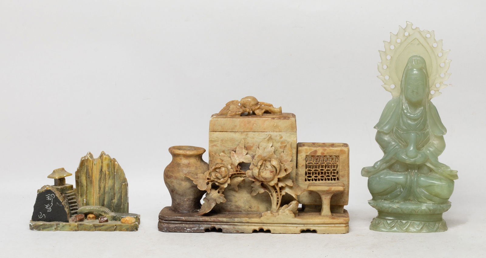 Vintage Chinese Translucent Jade, Stone Sculptures: Including a translucent jade Buddha sculpture, and two stone sculptures, one carved as landscape, the other carved as three vases flanked by flowers. Approx. 8*3.7*1.5 inch (Buddha size).