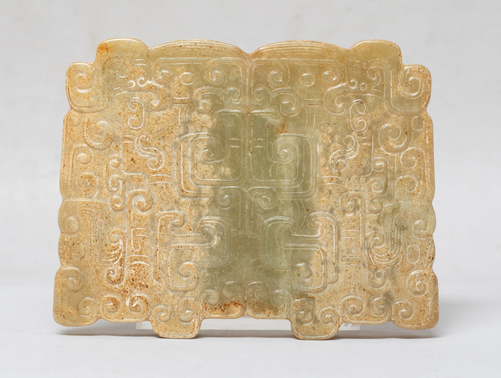 Chinese Russet Jade Carved Pendant: Large Chinese jade pendant, carved on either side delicately carved with entwined dragon and phoenix, drilled through the centre. Approx. 3.3*2.6 inch.