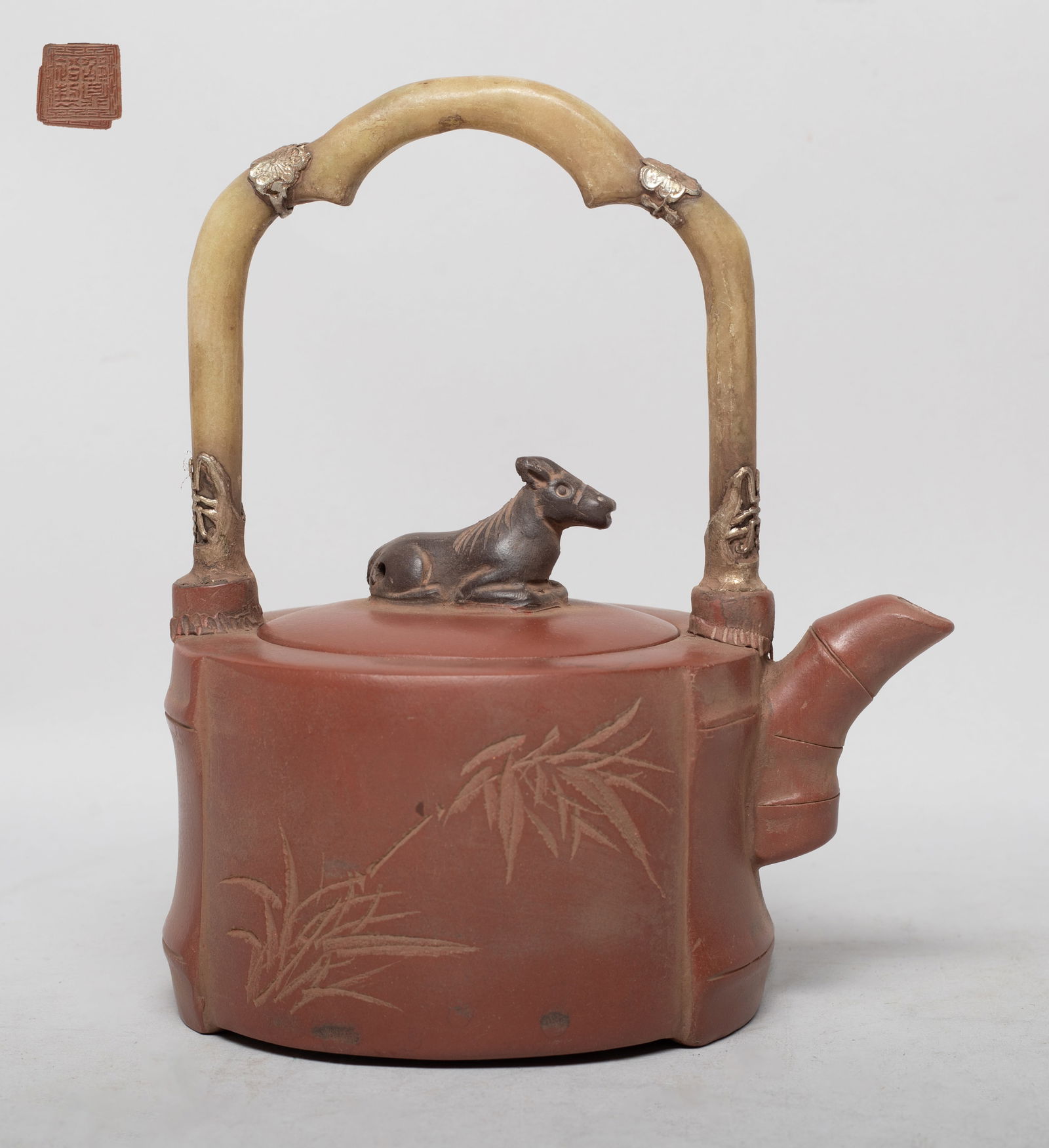 Chinese Yixing Zisha Tea Pot w/ Jade Handle: Of bamboo form with stone handle, the body incised with bamboo and inscribed with related passages, the lid with a beast finial, the bottom with a seal mark. Approx. 6.3*5.4*4 inch.