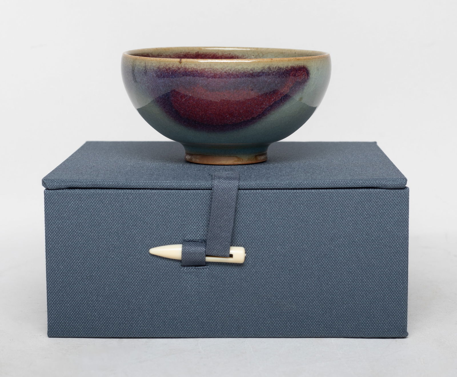 Collectible Chinese Jun Ware Porcelain Cup: The cup covered with crackled pale bluish gray glaze, splashed in purple around the inside and the rim, with box. Approx. 3.5*1.8 inch (cup size).