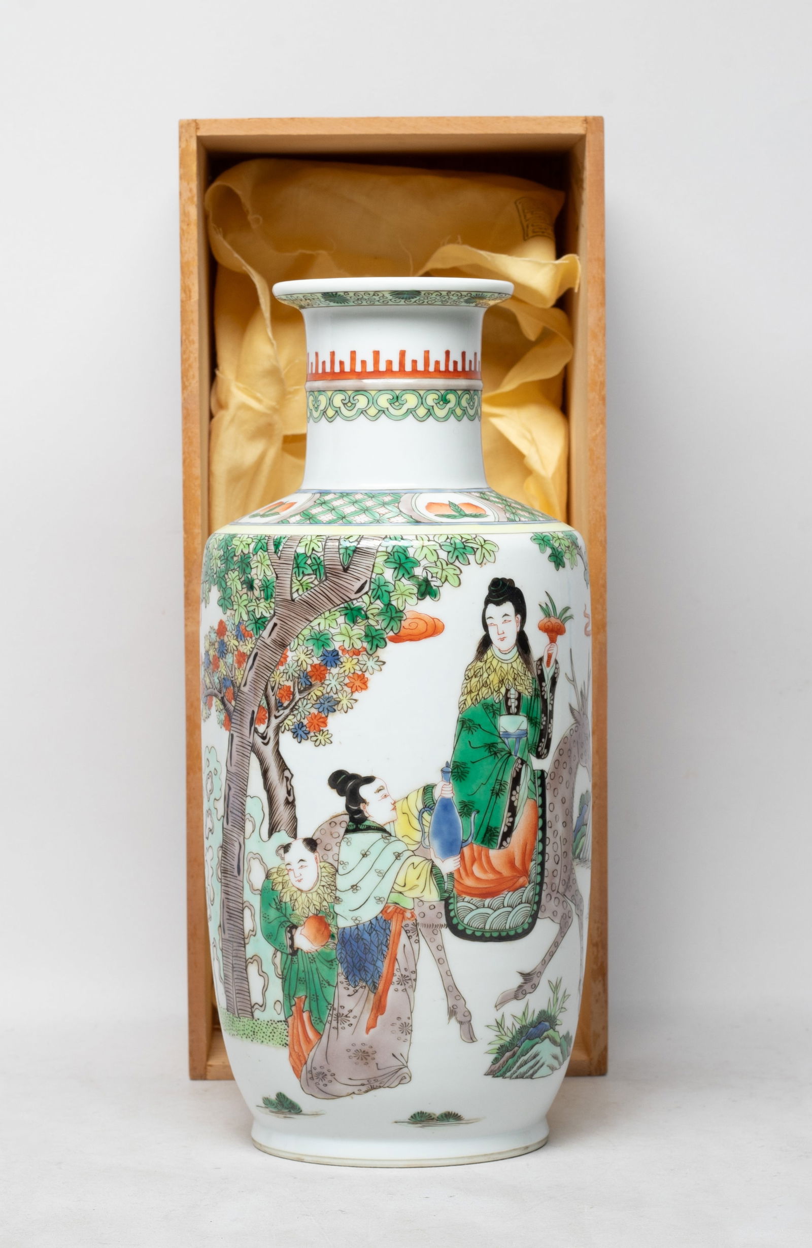 Tall Chinese Export Wuchai Porcelain Vase: The vase body painted with a man holding a basket of lingzhi and sitting on an elephant, a woman holding lingzhi and sitting on a deer, two servants aside holding bottle and peach, with a lidless box.