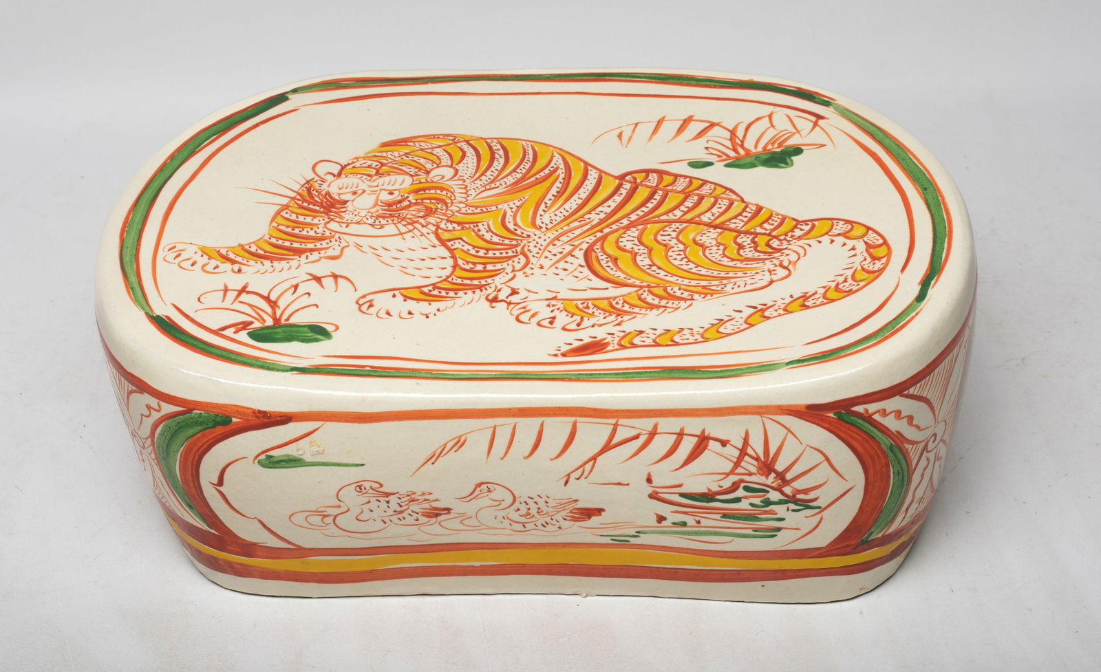 Large Chinese Glazed Stoneware Pillow: The pillow top painted with a crouching tiger, the sides with medallions of ducks or flowers, all in red, green and yellow colors on creamy glazed background. Approx. 11.6*7.8*4.3 inch.