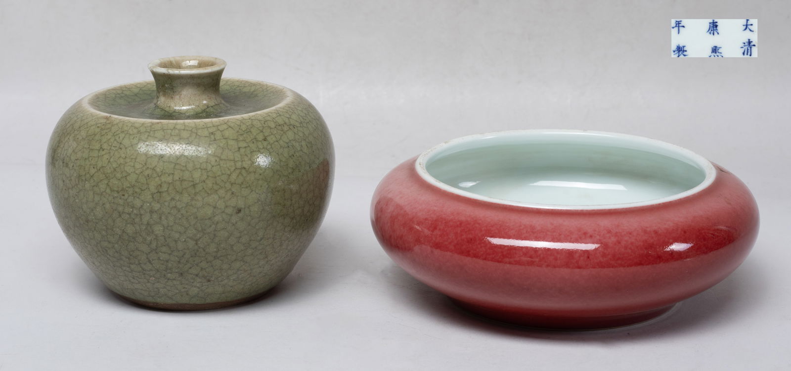 Estate Chinese Porcelain Water Pot & Washer: The water pot of ovoid form with a short waisted neck, overall covered with mottled olive-green glaze suffused with a matrix of crackles, the washer of compressed form, the exterior covered with