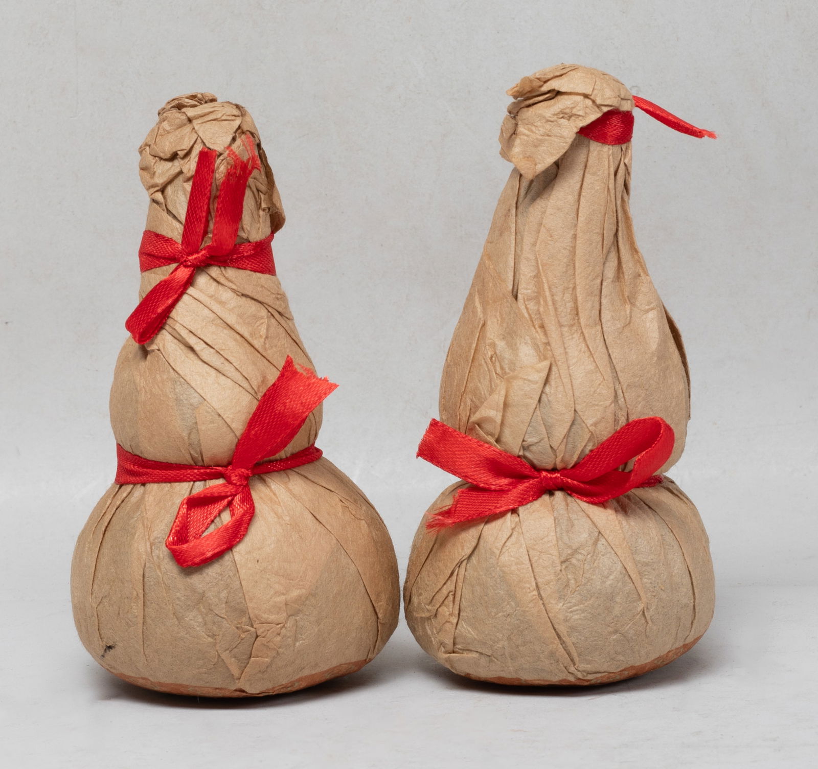 Two Chinese Export Tea Bricks: Two Chinese export tea bricks of double gourd shape. Approx. 5.2*2.8 inch (each).