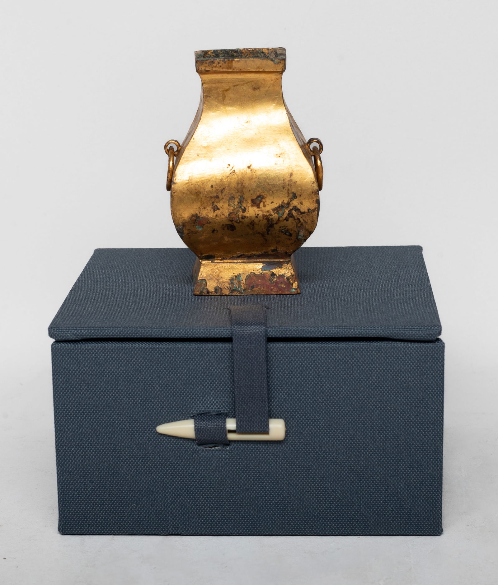 Estate Chinese Gilt Bronze Cabinet Vase: Of square section, the pear-shaped body rising from a splayed foot, flanked by two loop handles, with box. Approx. 2.8*1.7*1.7 inch (w/o box).