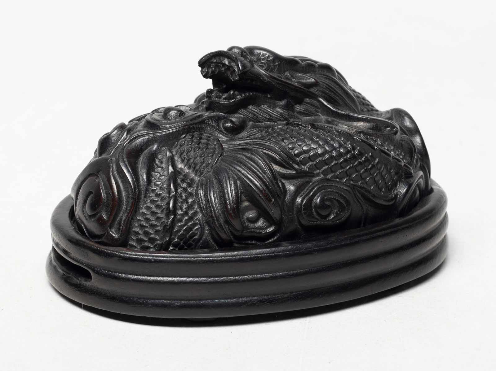 Estate Chinese Wood Carved Dragon Censer: Carved as a ferocious dragon coiled amidst clouds, with one paw grasping a ball. Approx. 5.4*3.8*2.9 inch.