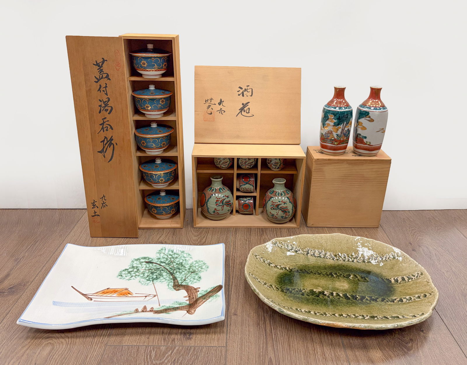 Set Vintage Japanese Porcelain Plates, Cups: Group of vintage Japanese porcelain cups, bottles, and plates, with three boxes. Approx. 14.2*17.5 inch (largest plate).