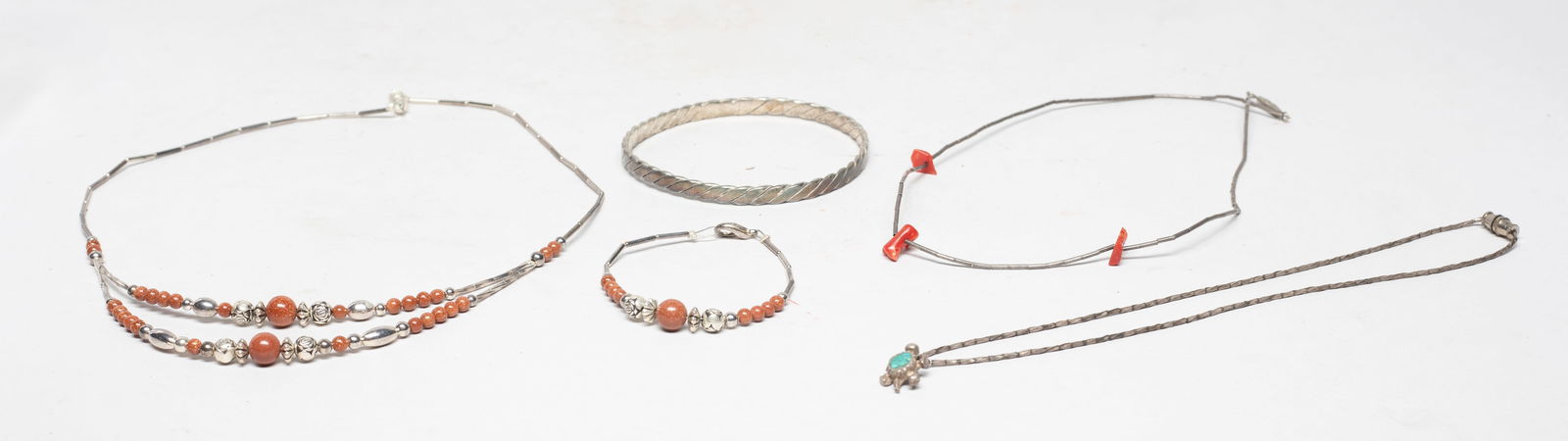 Navajo Style Silver Necklaces: Including a bangle, a bracelet, and three necklaces. Approx. 39 gram (total weight), 18 inch L (longest).