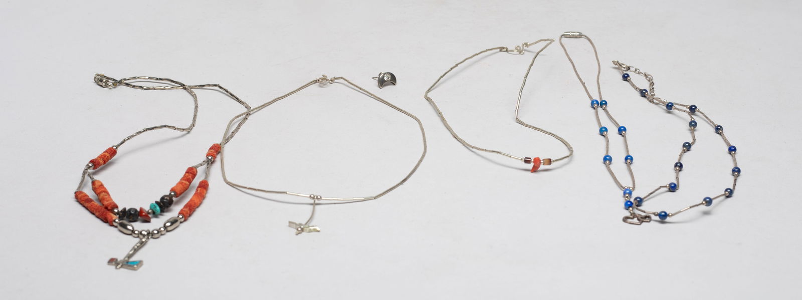 American Indian Type Silver Necklaces: Including four American Indian type silver necklaces, and a half moon shape ear stud. Approx. 28 gram (total weight), 17 inch L (longest).