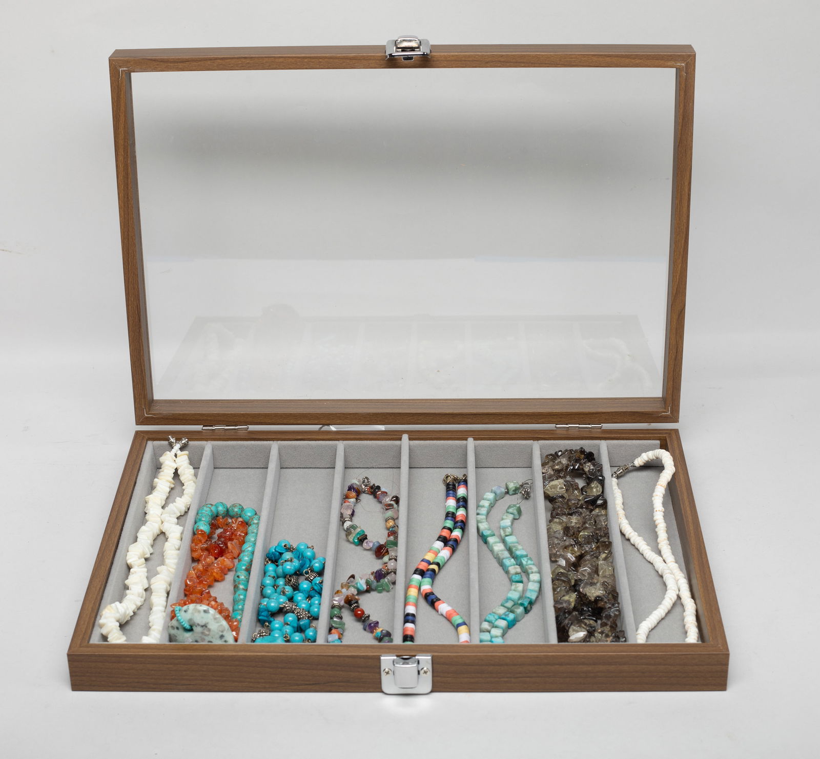 Native American Type Designed Stone Jewelry: Set of eight Native American style designed multi stone necklaces, with case. Approx. 34 inch L (largest). The Estate of the Store Closed Sale, Little Tokyo, Los Angeles, 2022.