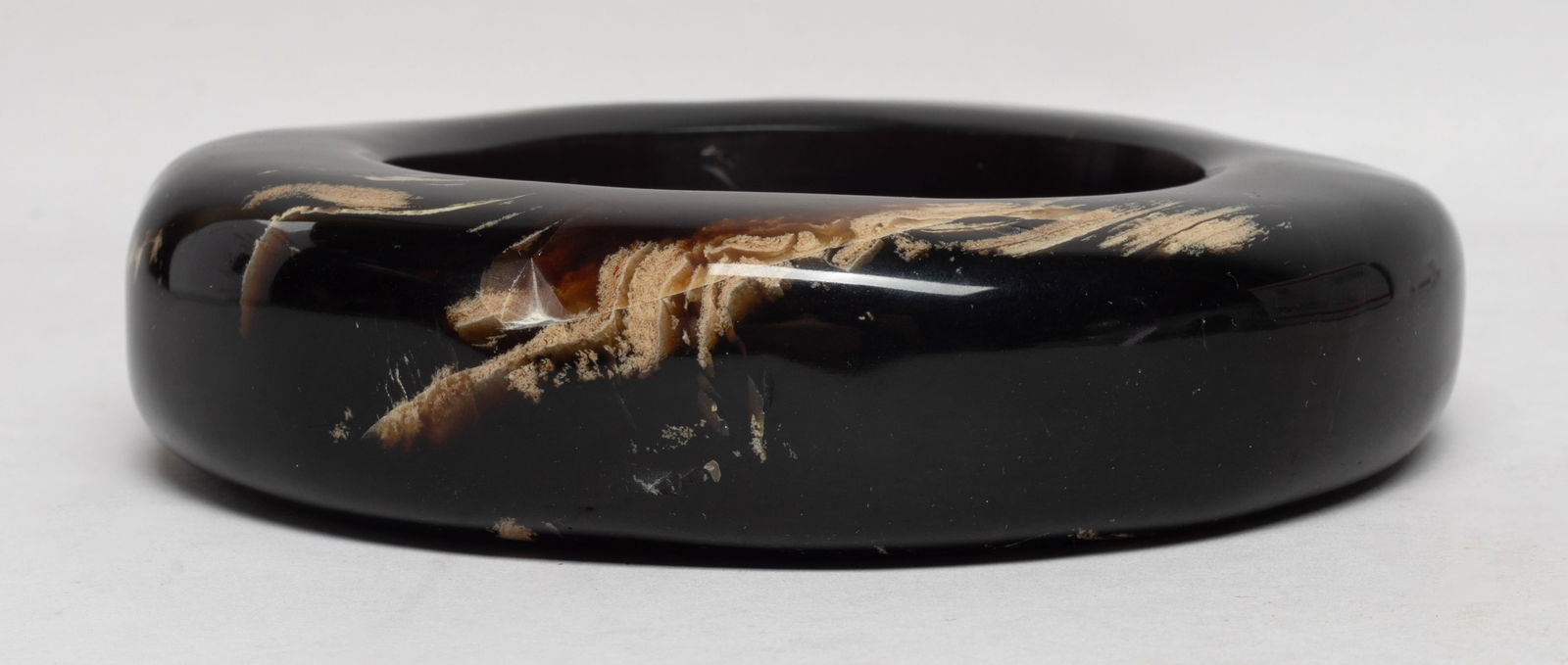 Estate Chunk Root Amber Bangle: Collectible chunky root amber carved bangle. Approx. 252 gram, 5.47 inch outer width, 3.2 inner width. The Estate of S Pasadena, CA, 2024.