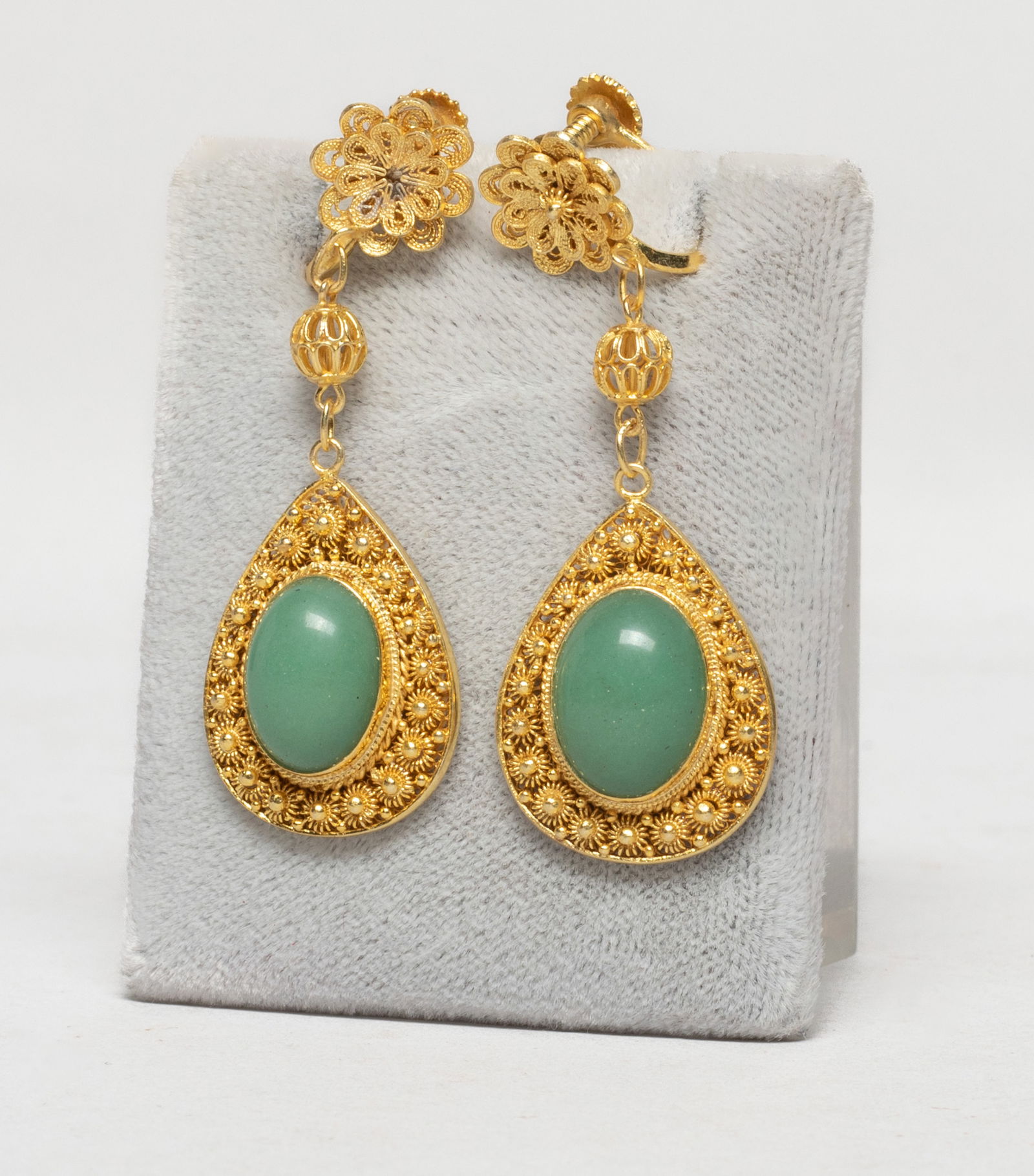 Chinese Gold on Sterling Silver Earrings: A pair of designed Chinese gold on sterling silver earrings, inlaid with green stone. Approx. 10.9 inch (total weight), 2.05*0.74 inch (each). The Estate of Store Moving Sale, Downtown Los Angeles.