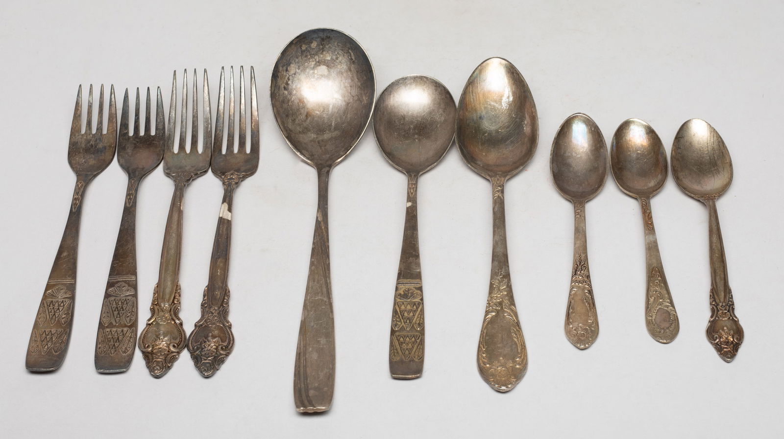 Vtg. Russian Silver Plated Services. MHU: Vintage Russian silver plate flatware pieces, including six spoons and four forks, each marked MHU on the handle. Approx. 550 gram (total weight), 9*2.2 inch (largest). The Estate of the Store
