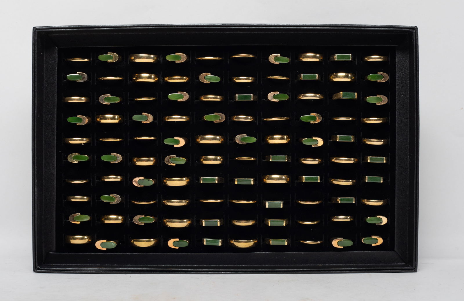 Chinese Gold Filled, Spinach Jade Rings: Large set of Chinese gold-filled rings, some inlaid with spinach jade, with tray. Size varies. The Estate of the Store Closed Sale, Little Tokyo, Los Angeles, 2022.