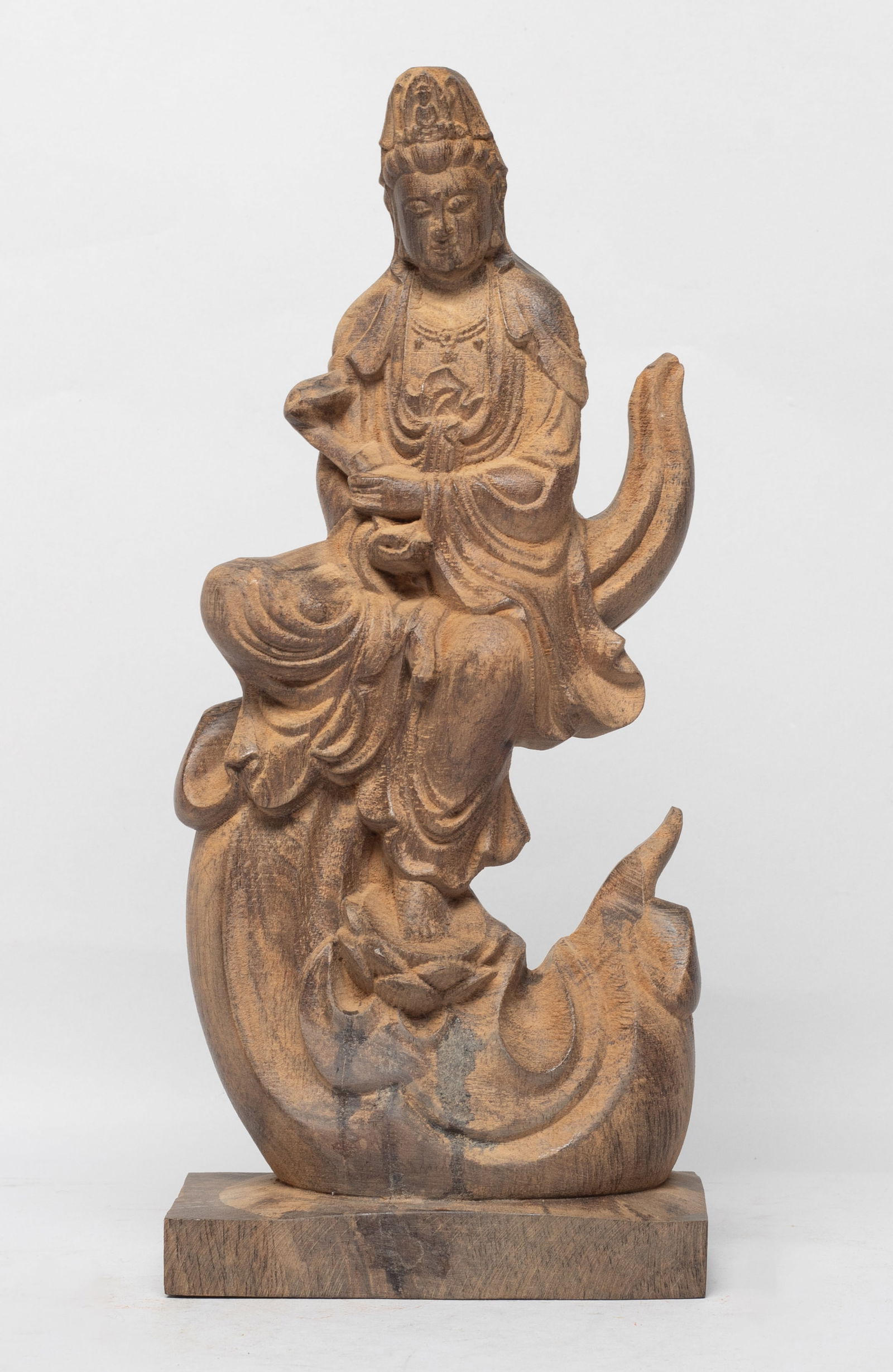 Collectible Chinese Export Agarwood Sculpture: Carved as Kuanyin seated over clouds on a rectangular base, dressed in a long flowing robe, the left hand holding ruyi. Approx. 783 gram, 10*4.4*2.4 inch.