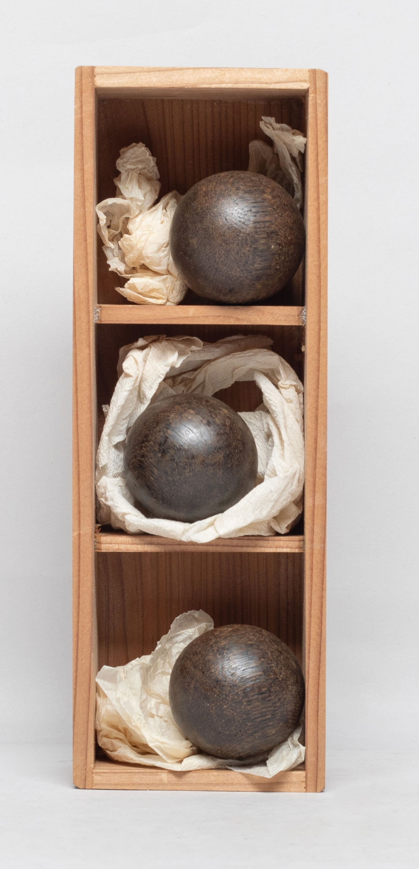 Set Three Chinese Agarwood Balls: Set of three Chinese agarwood carved balls, with a lidless case. Approx. 97 gram (total weight), 1.57 inch D (largest ball). The Estate of the J & J Found, AZ, 2021.