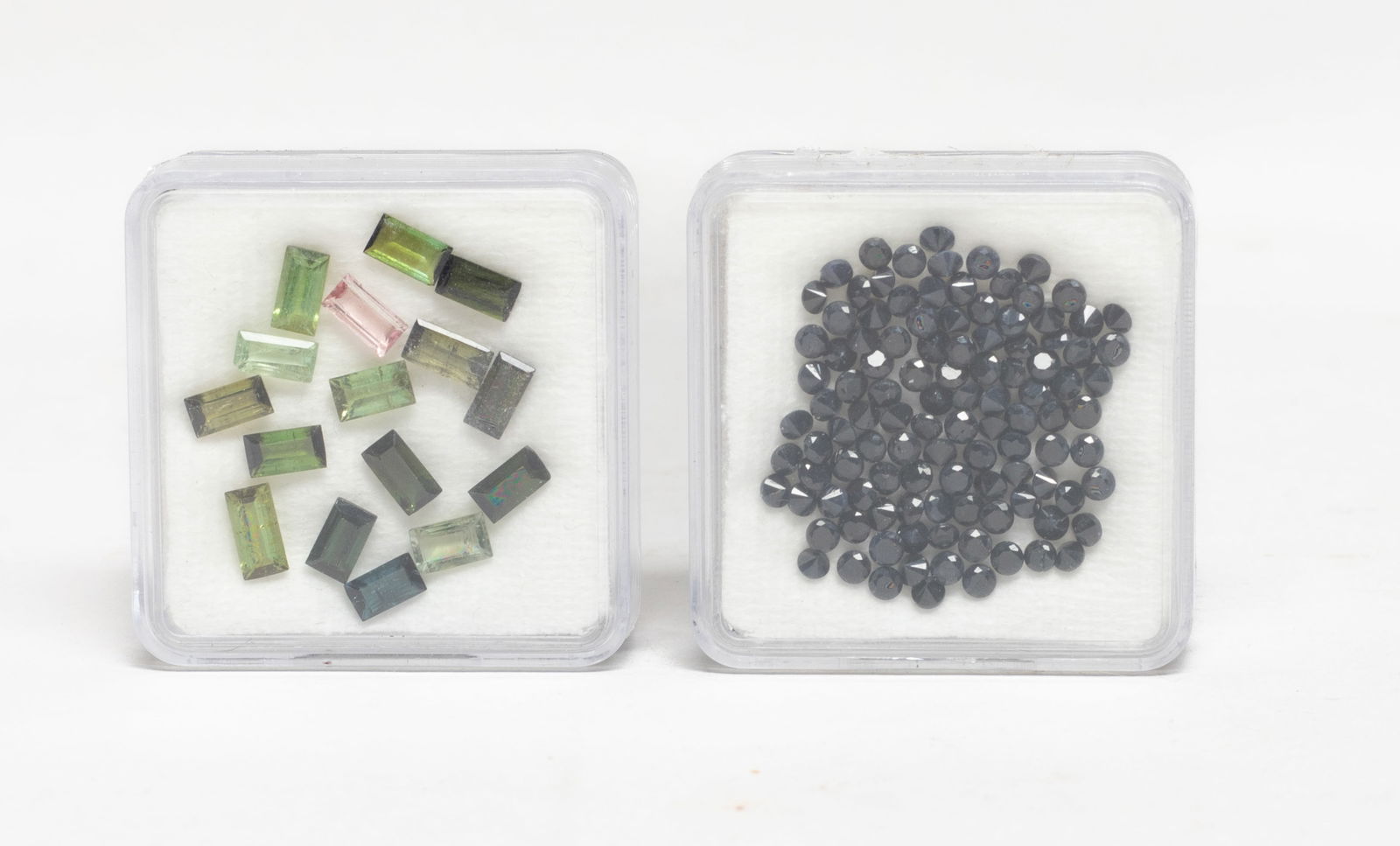 Tourmaline, Gemstone Cut Stones: Collection of tourmaline and gemstone cut stone pieces, with cases. Size varies. The Estate of Store Moving Sale, Downtown Los Angeles. 2025.