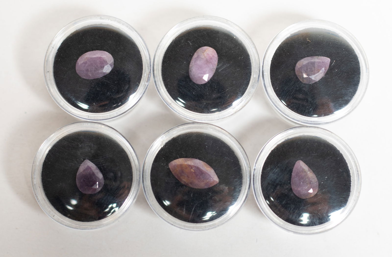 Estate Cut Ruby Stone Ring Face: Collection of rubi stone cut ring face, with cases. Size varies.