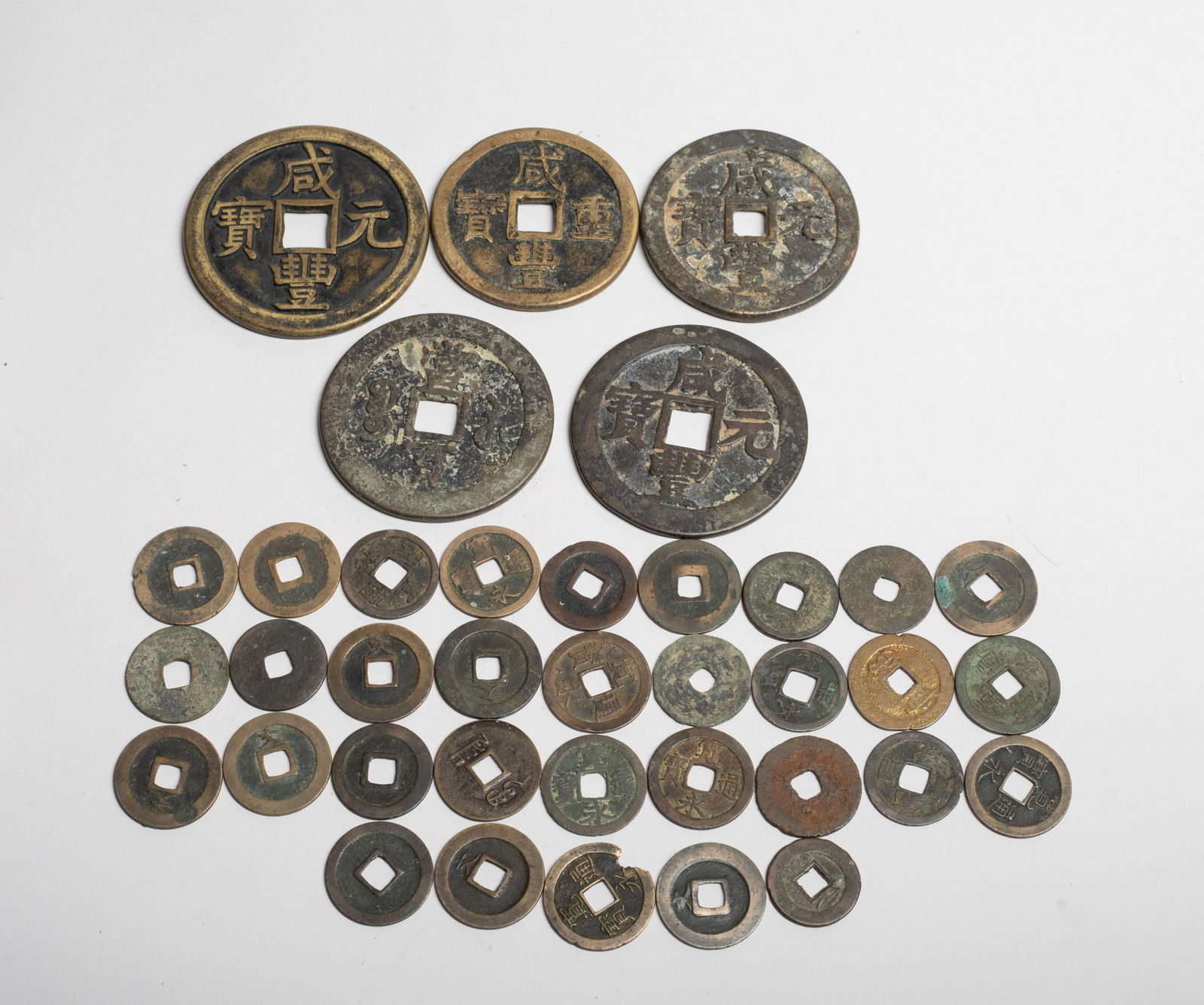 Set Chinese, Asian Fengshui Coins: Large set of Chinese and Asian Fengshui coins. Approx. 2.45 inch D (largest). The Estate of the Consignment Store Closed Sale, Palm Springs. CA. 2025.