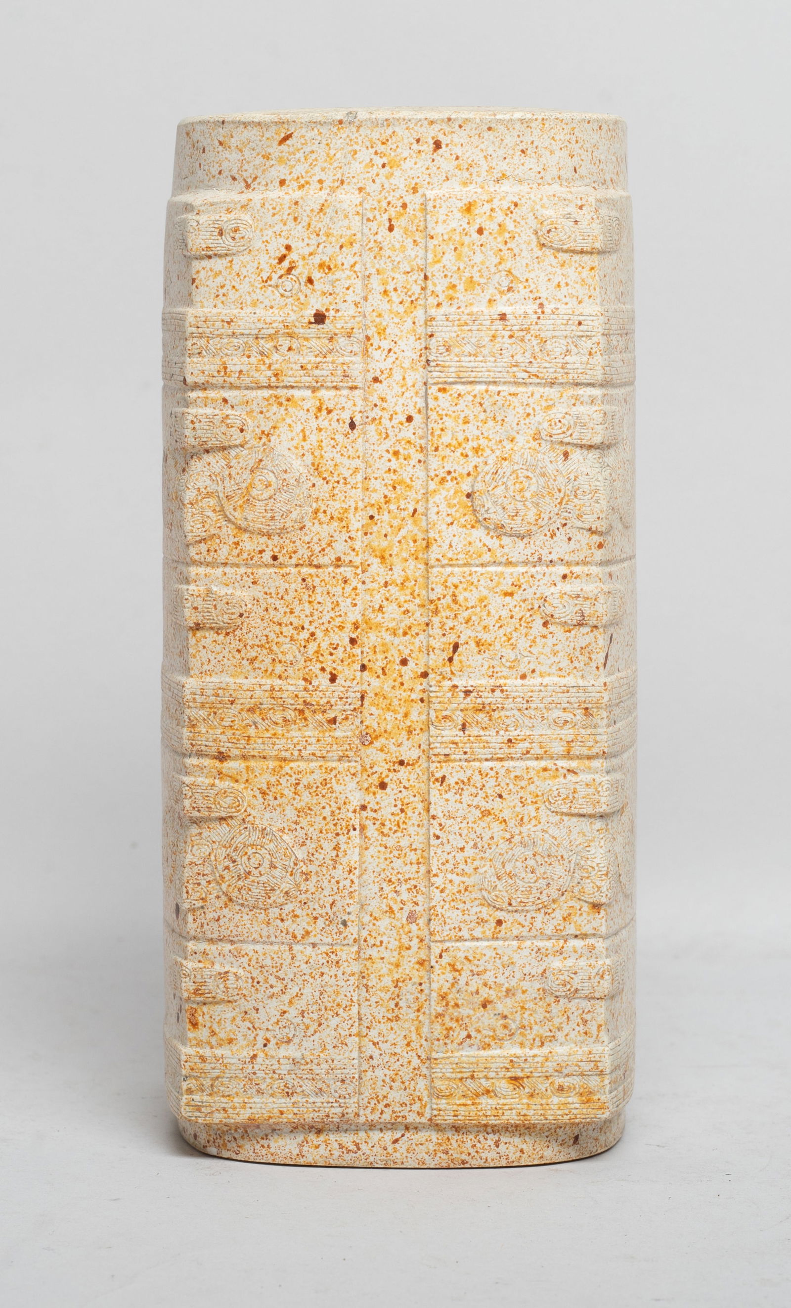 Chinese Burnt Jade/ Stone Carved Cong: The cylindrical tube combined with a square- section body cut with groups of horizontal bands forming stylized masks along the edges, the stone of creamy tone with russet inclusions. Approx. 6.3*2.9*2