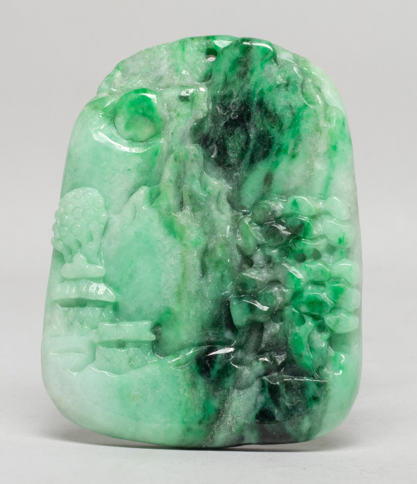 Estate Vintage Chinese Jade Pendant: Chinese jade pendant, one side carved with mountain landscape scene. Approx. 2.45*1.9 inch. The Estate of S Pasadena, CA, 2024.
