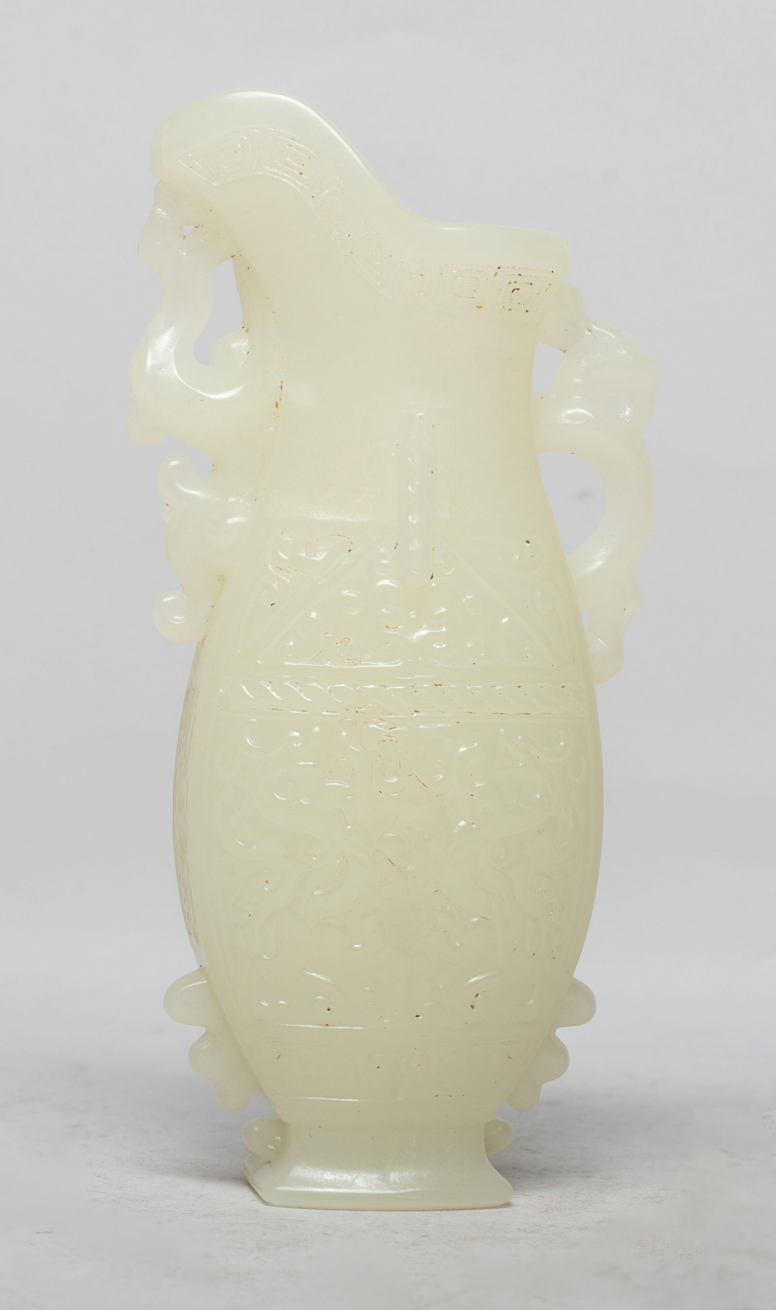 Rare Chinese Export Jade Like Vase: The vase body carved with stylized beasts and archaic scrolls on both sides, with a beast forming the handle, and another beast under the spout. Approx. 5.9*2.9*1.5 inch. The Estate of the Store Close