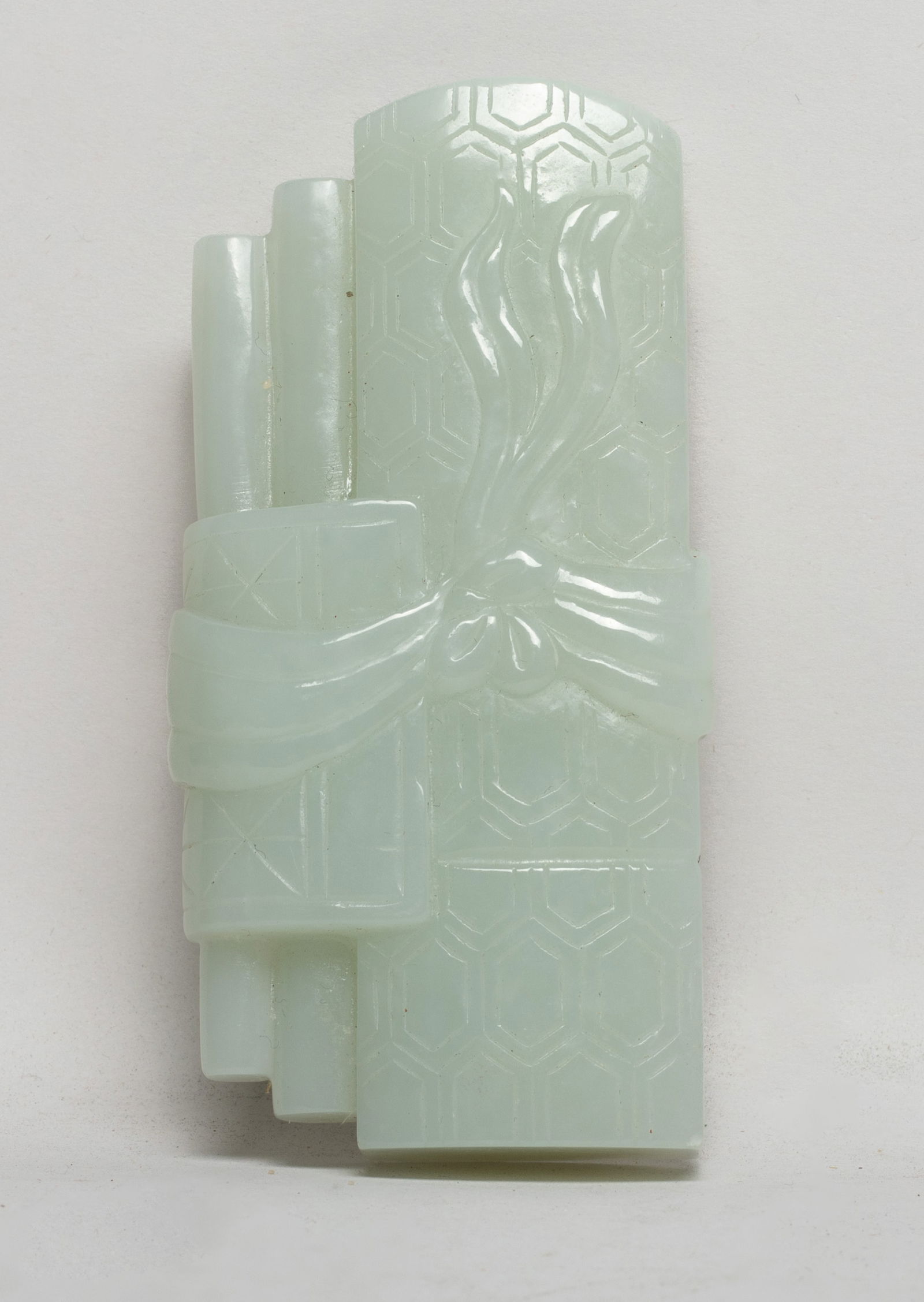 Large Chinese White Color Jade Carving: Carved as guqin, chess board, painting and calligraphy beribboned by scarf. Approx. 3.7*1.9*0.83 inch. The Estate of E Los Angeles, CA. 2022.